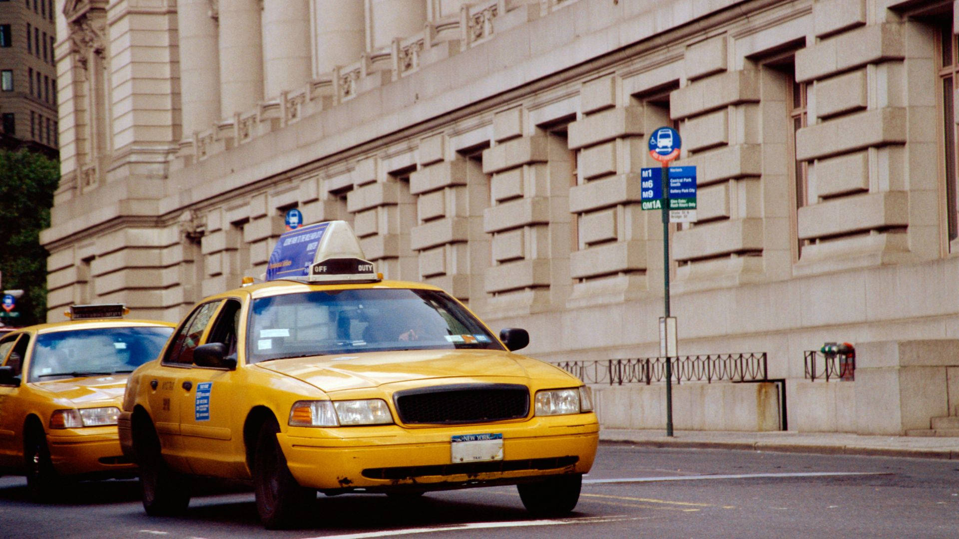 Taxi At The Side Of Classical Building Background