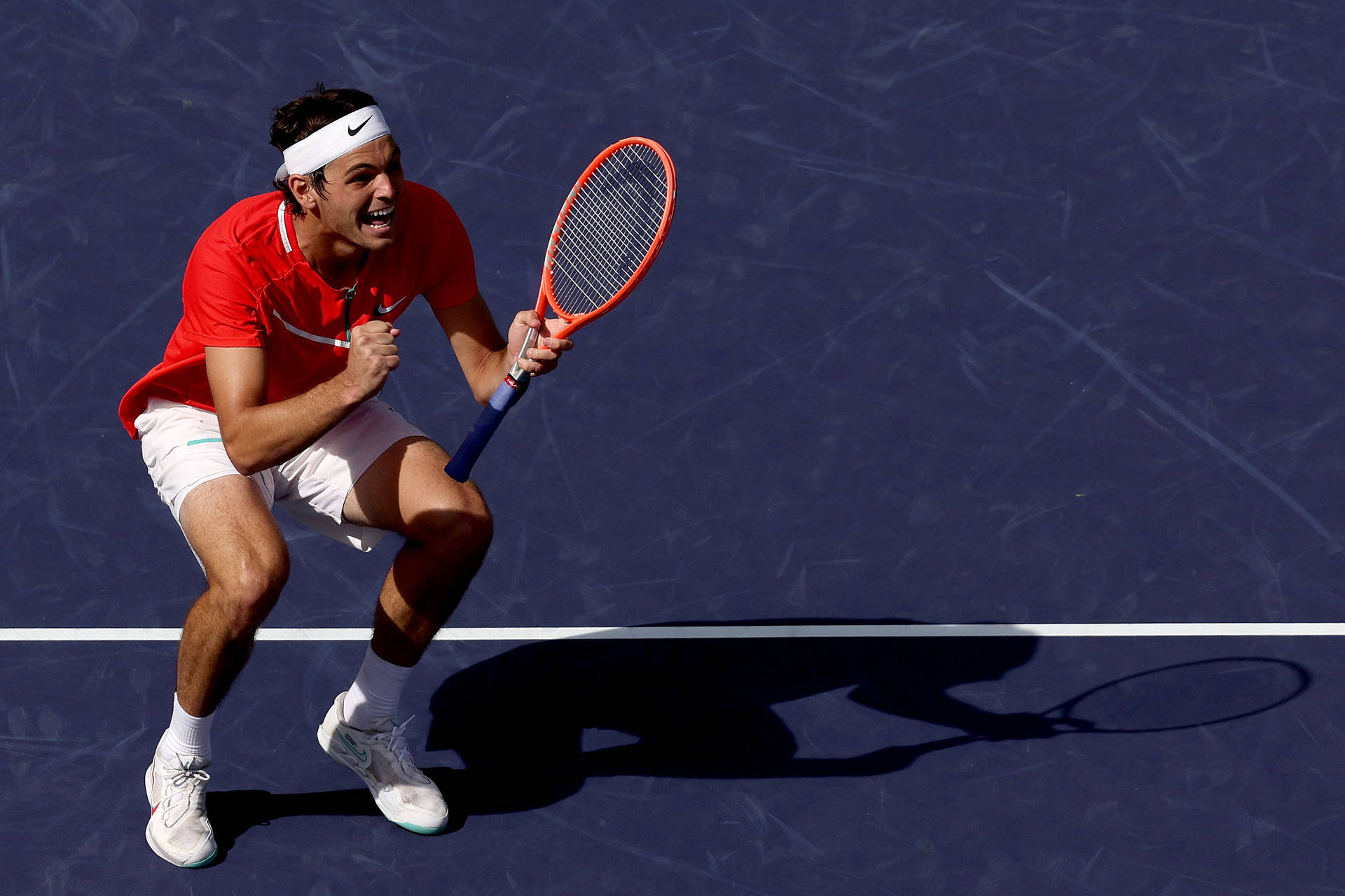 Taylor Fritz Celebrating Victory In A Tennis Match Background