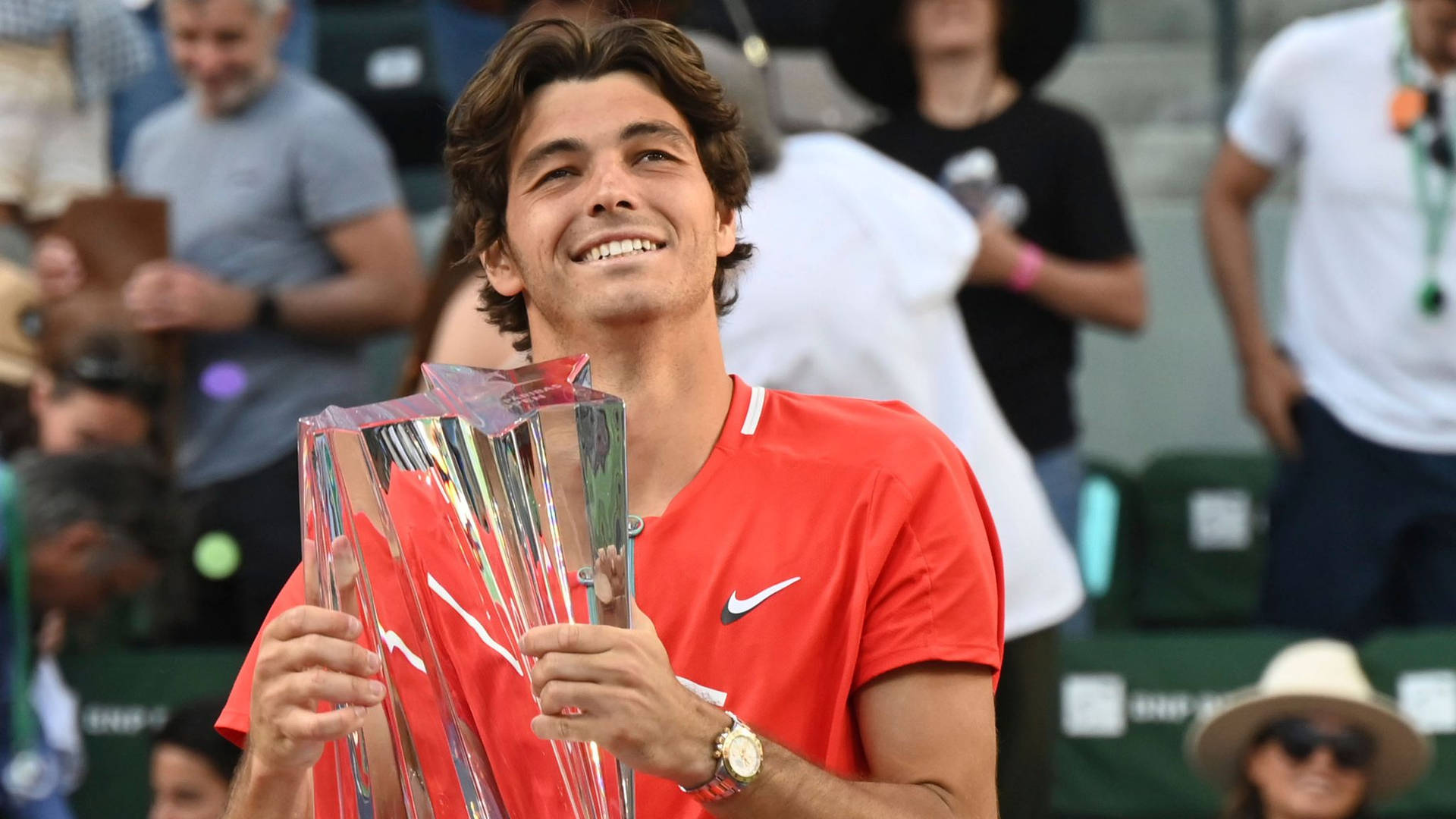 Taylor Fritz Holding Championship Trophy Background