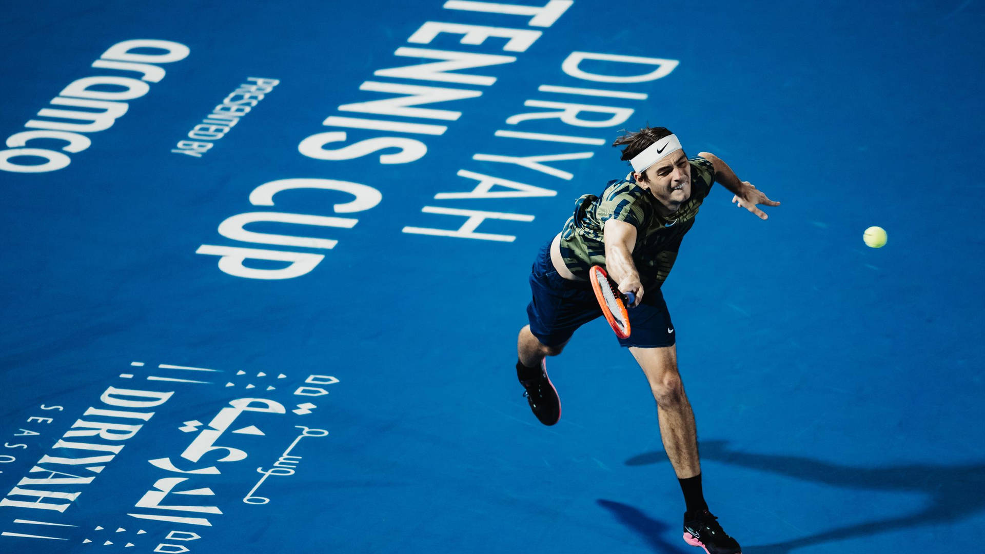 Taylor Fritz In A Blue Tennis Court