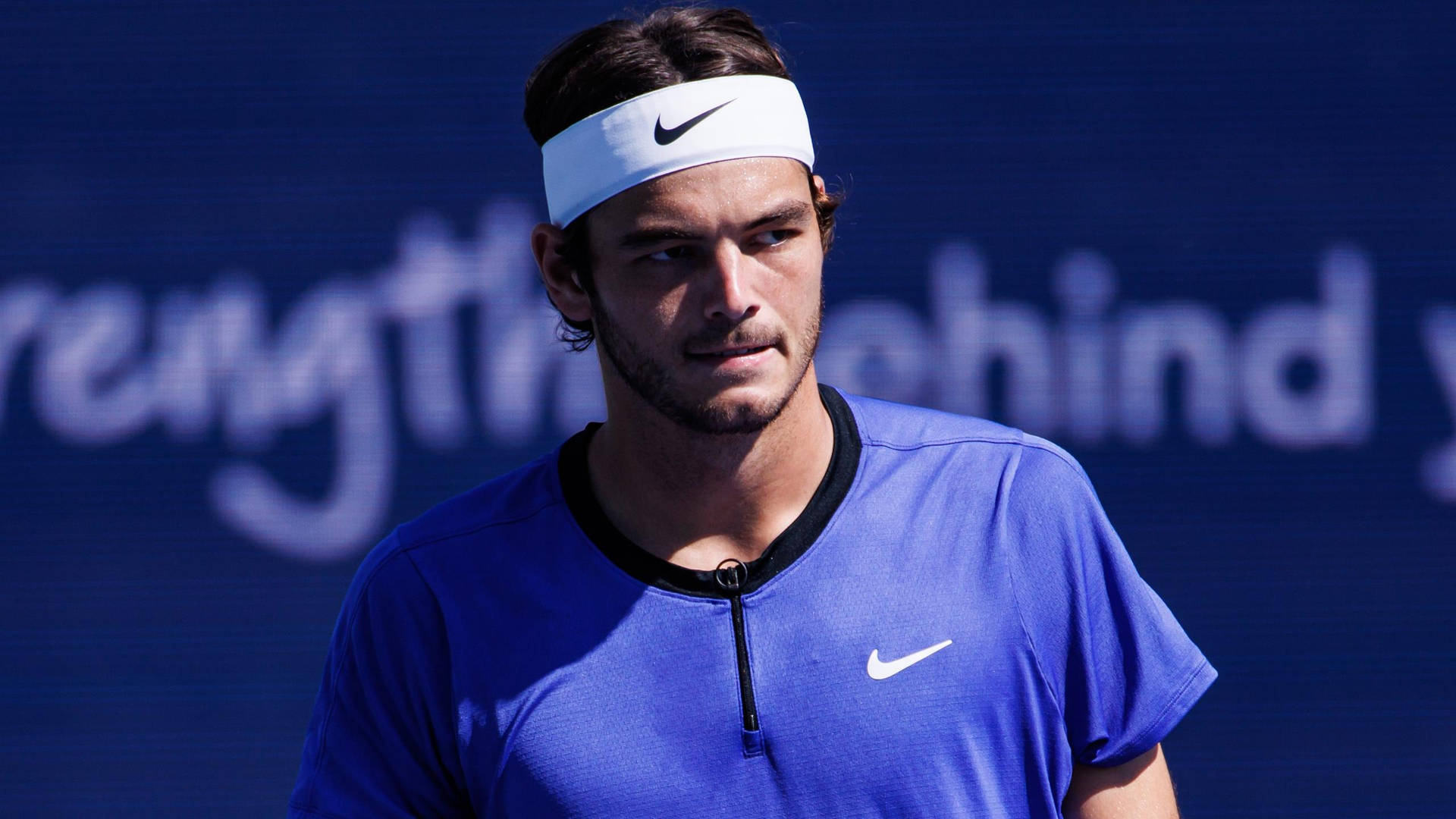 Taylor Fritz In Blue Shirt Background