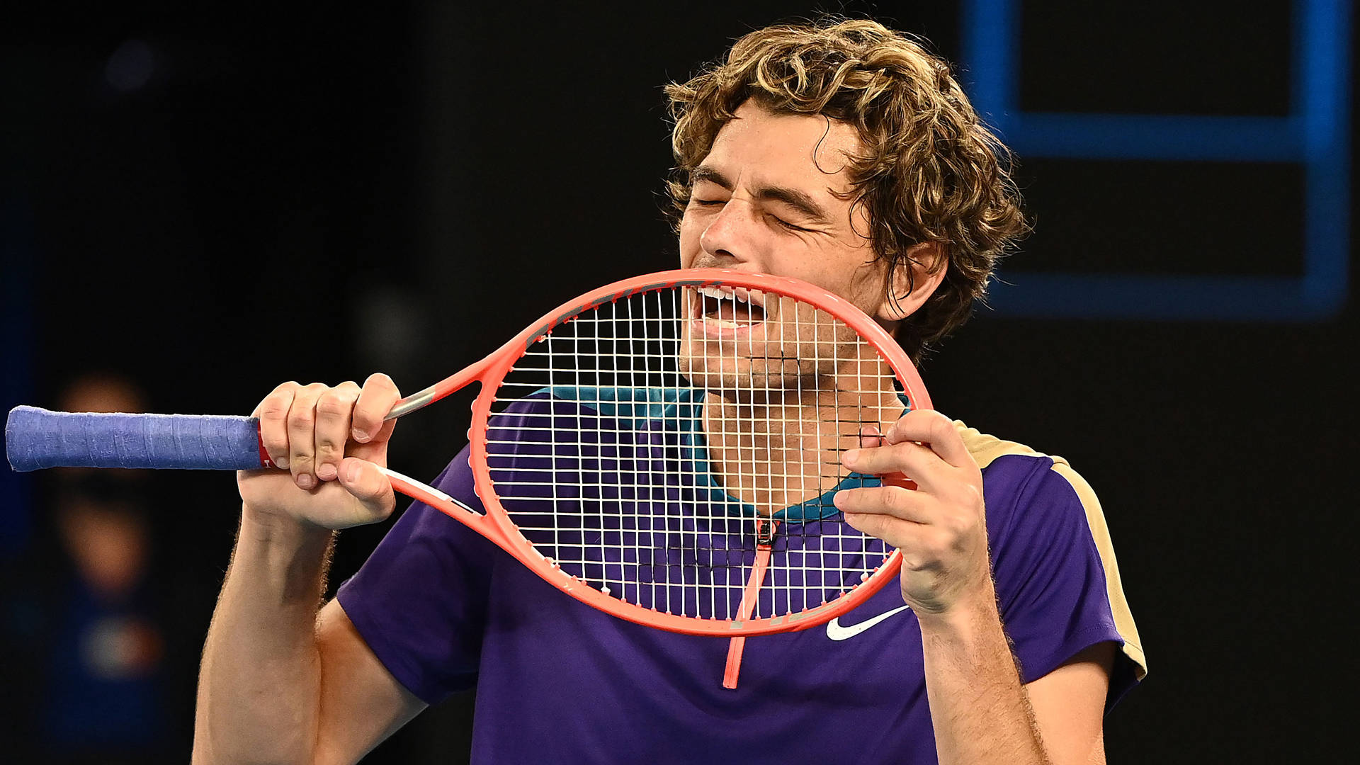 Taylor Fritz Posing With His Racket Background