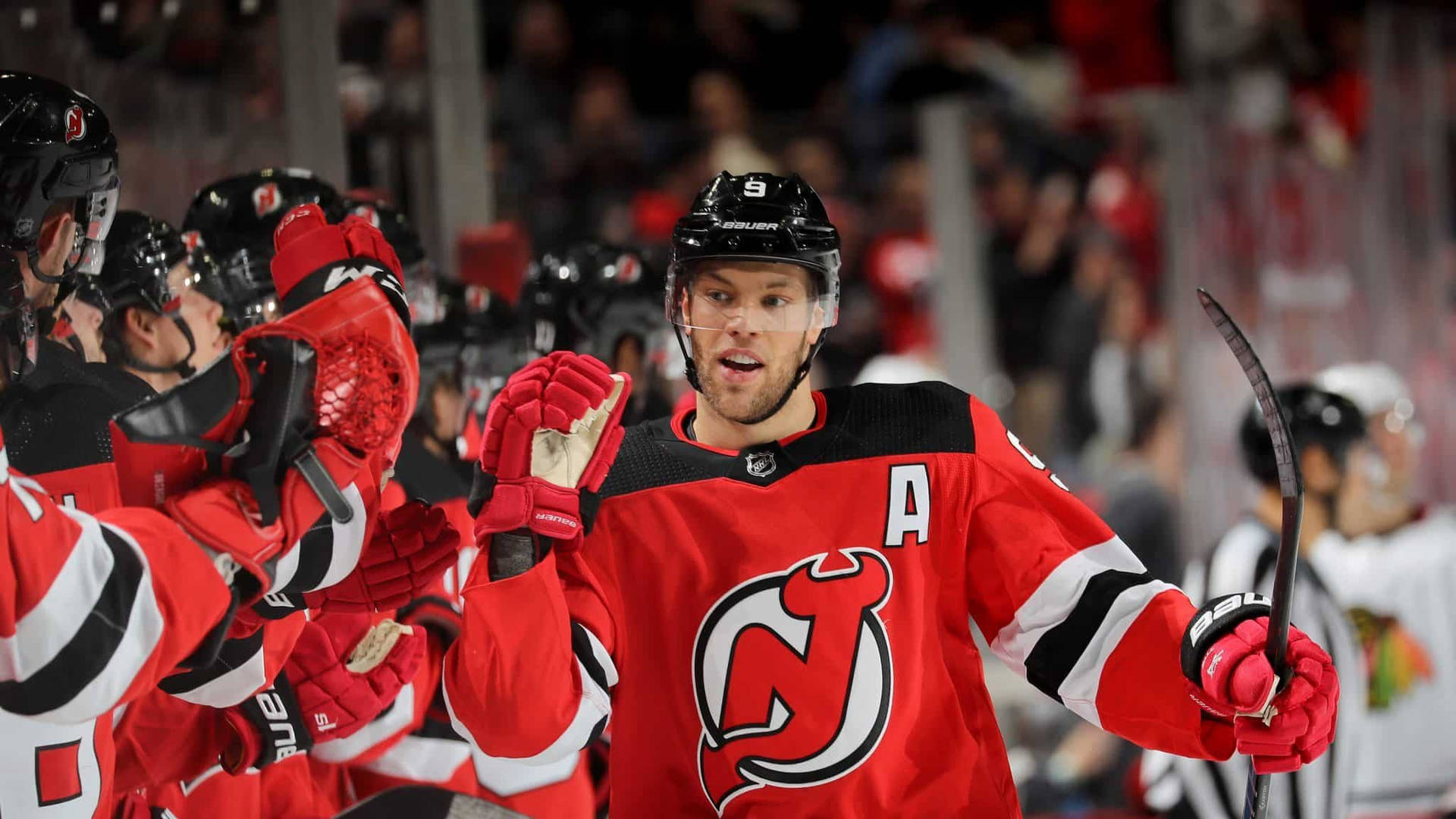 Taylor Hall In Action With The New Jersey Devils Background