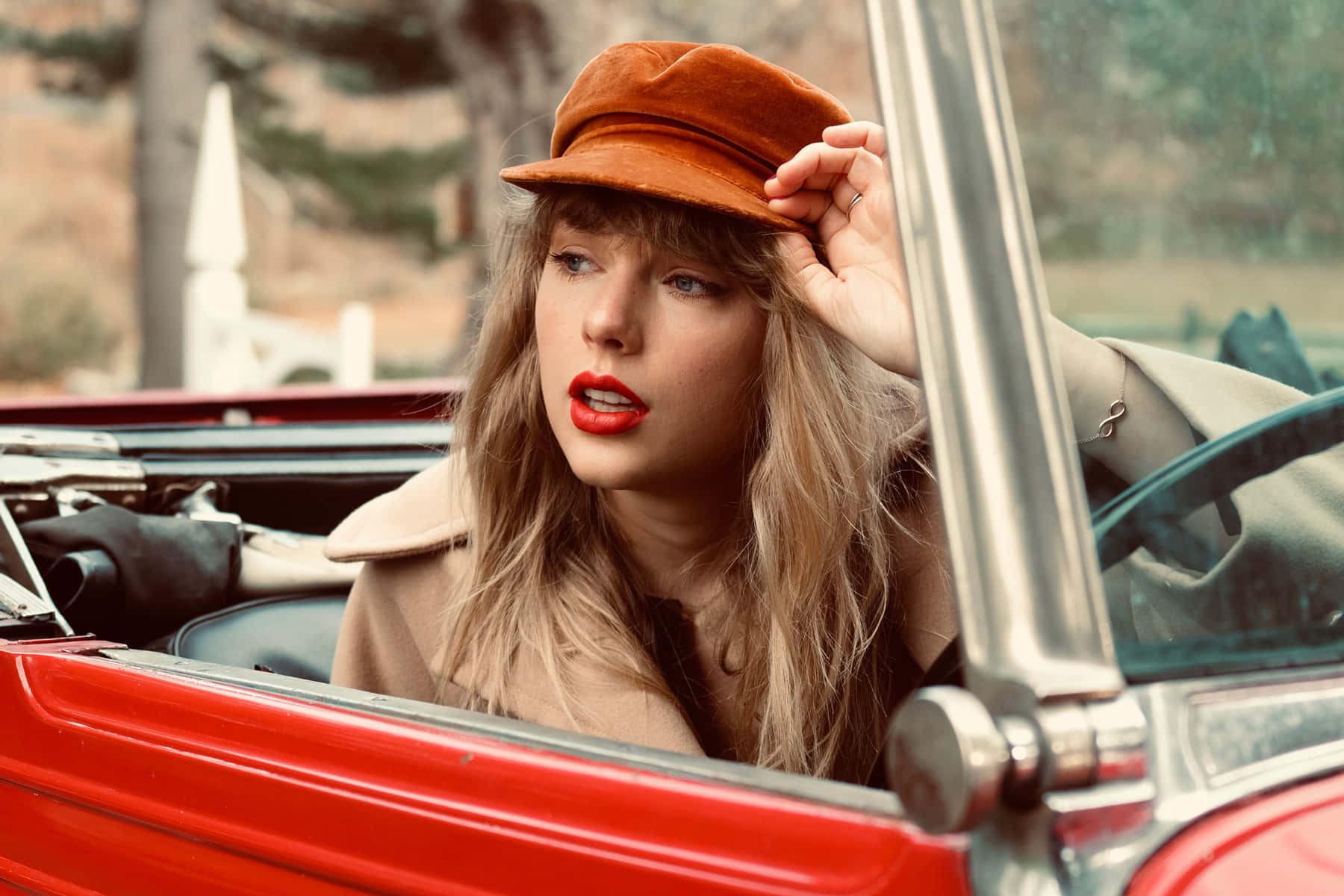 Taylor In A Convertible From Red Taylors Version Background