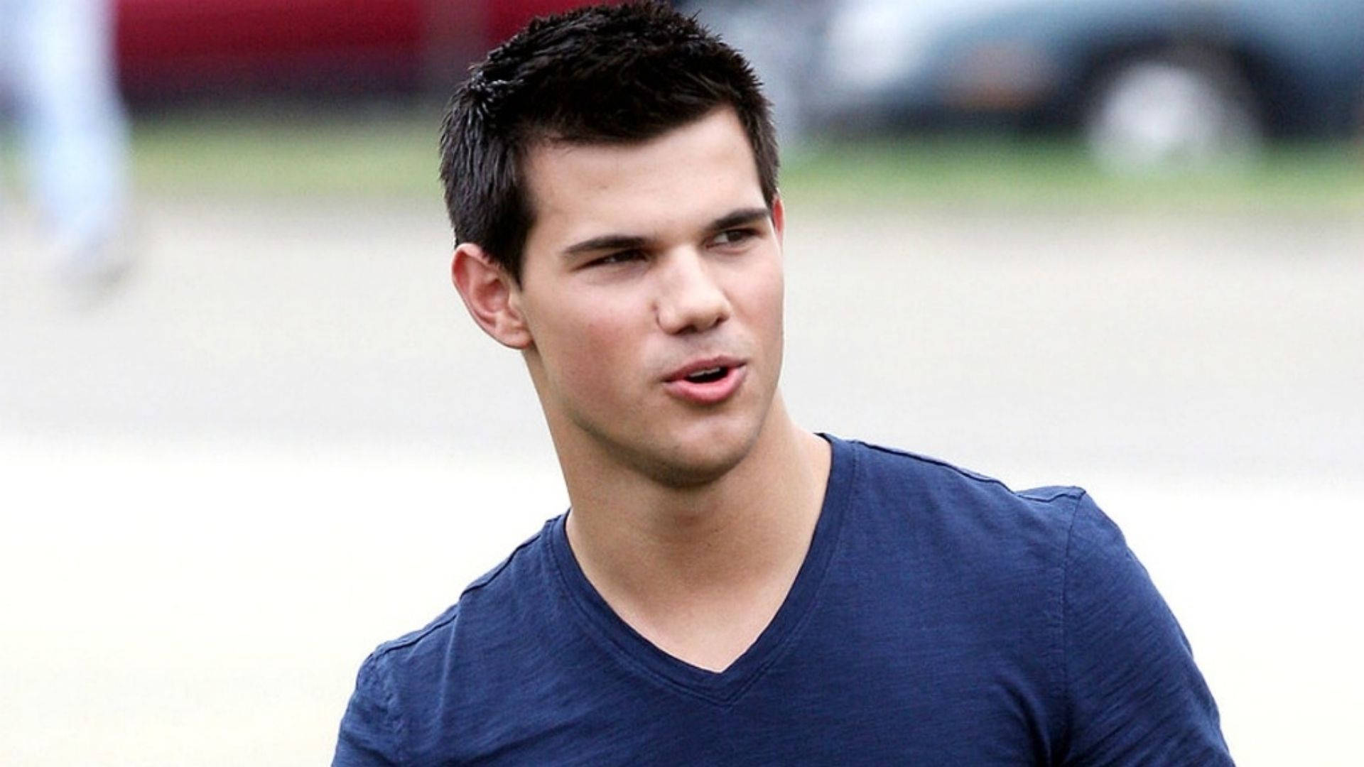 Taylor Lautner Looking Away Background
