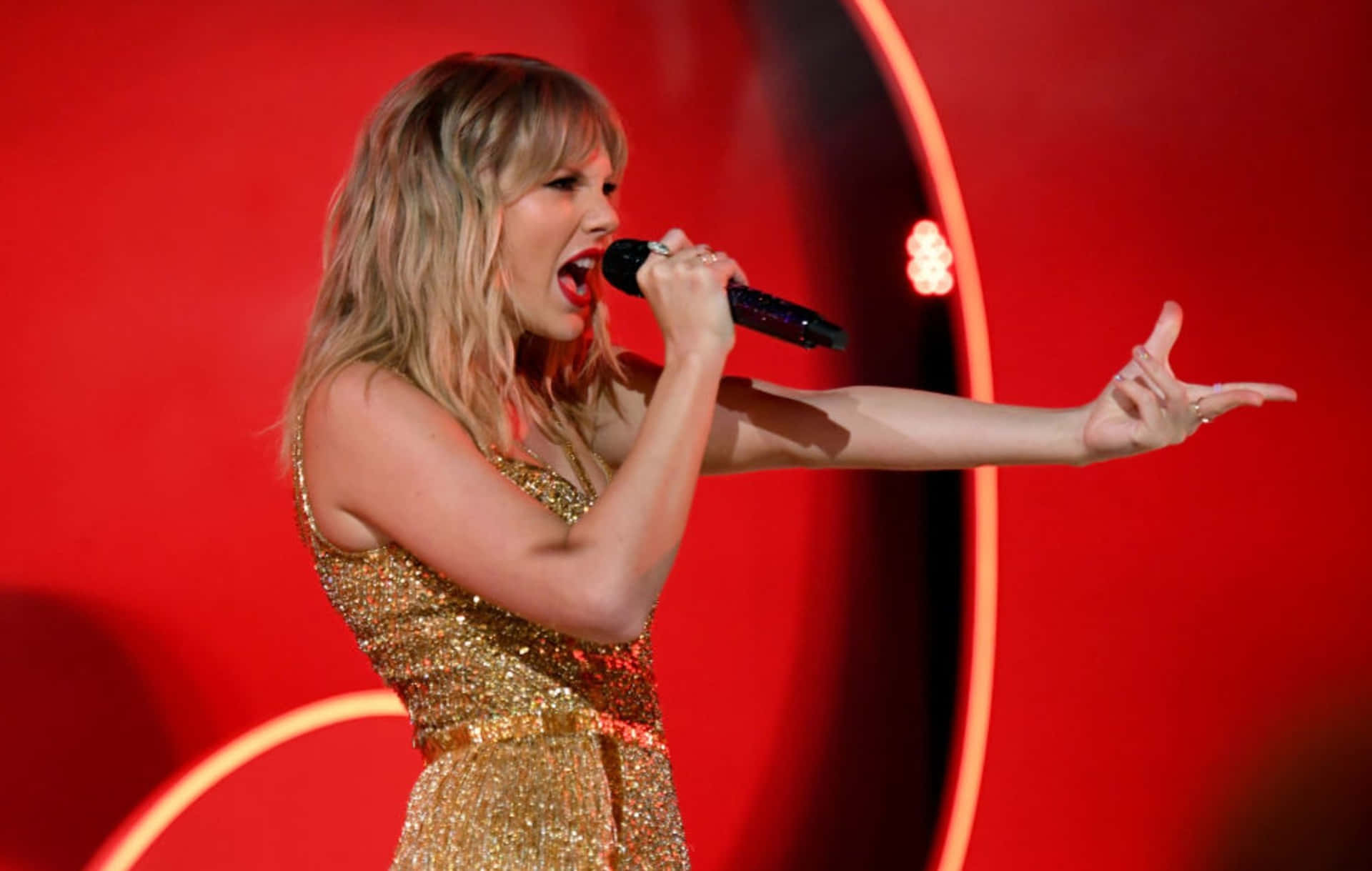 Taylor Swift Delivers A Stunning Performance In Her Red Taylor's Version Album Background