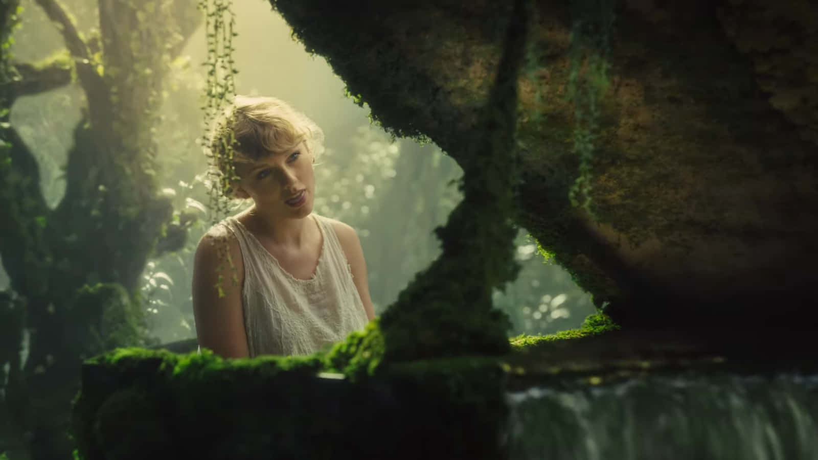 Taylor Swift Looks Into The Camera During The Recording Of 'folklore', An Album She Released In 2020 Background