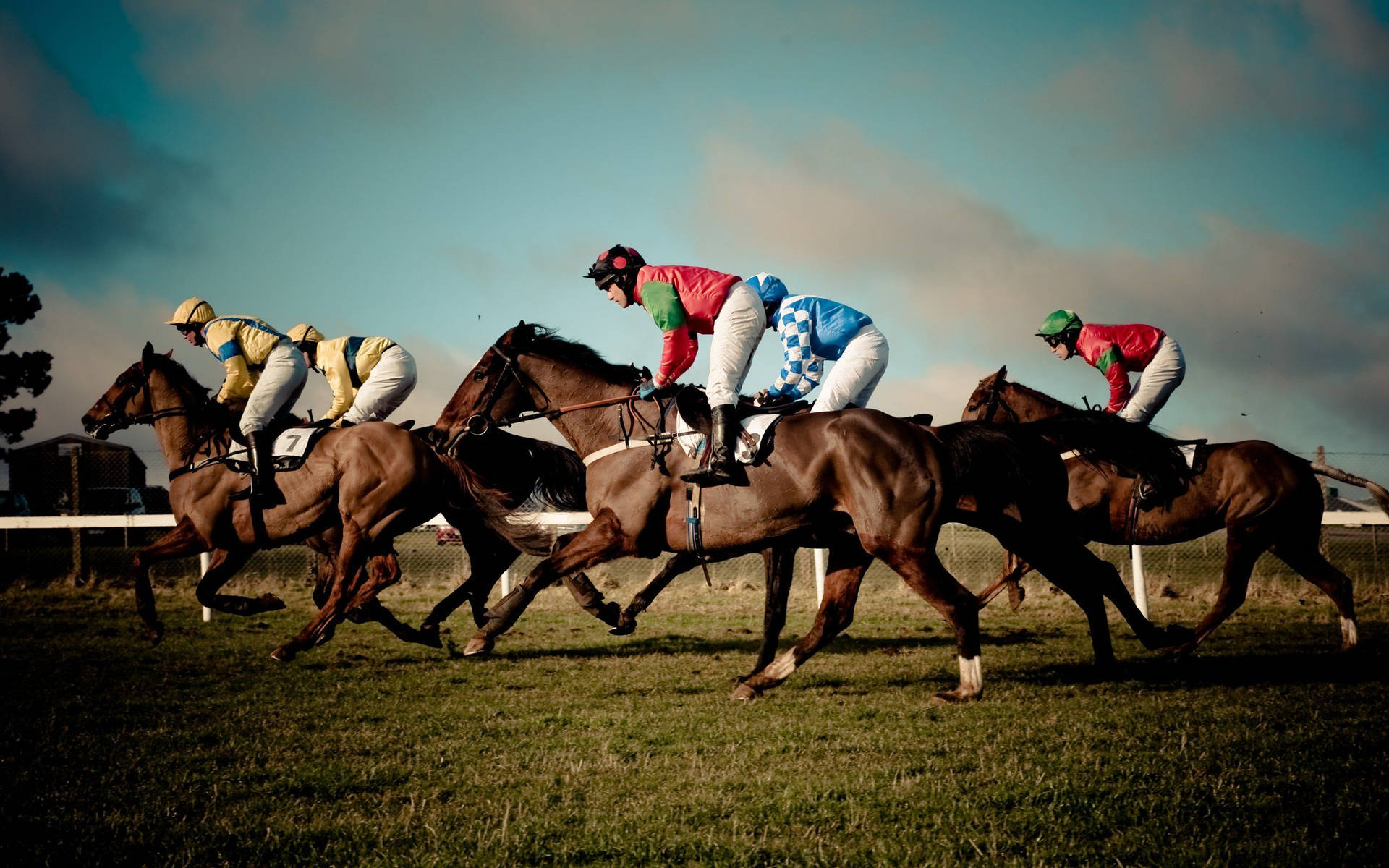Team Horse Riders In Horse Racing Background