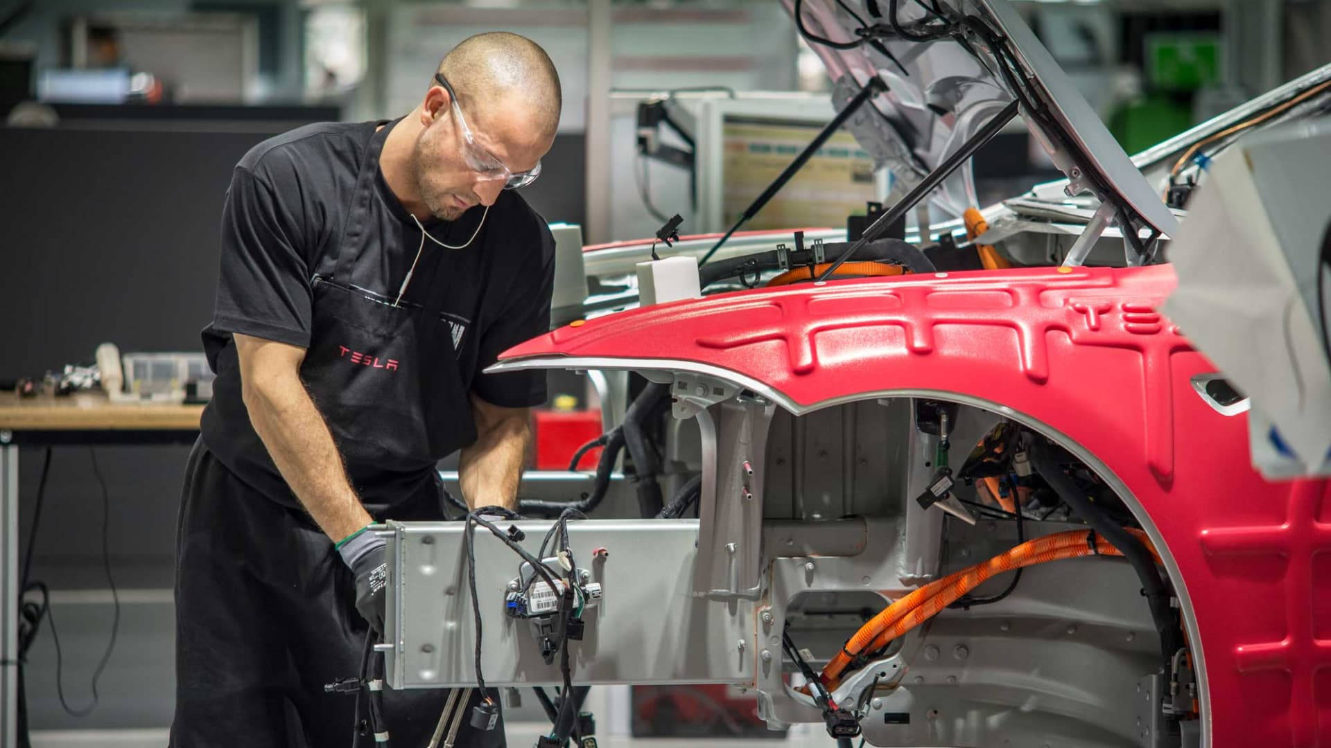 Technician Assembling Car Tesla Factory