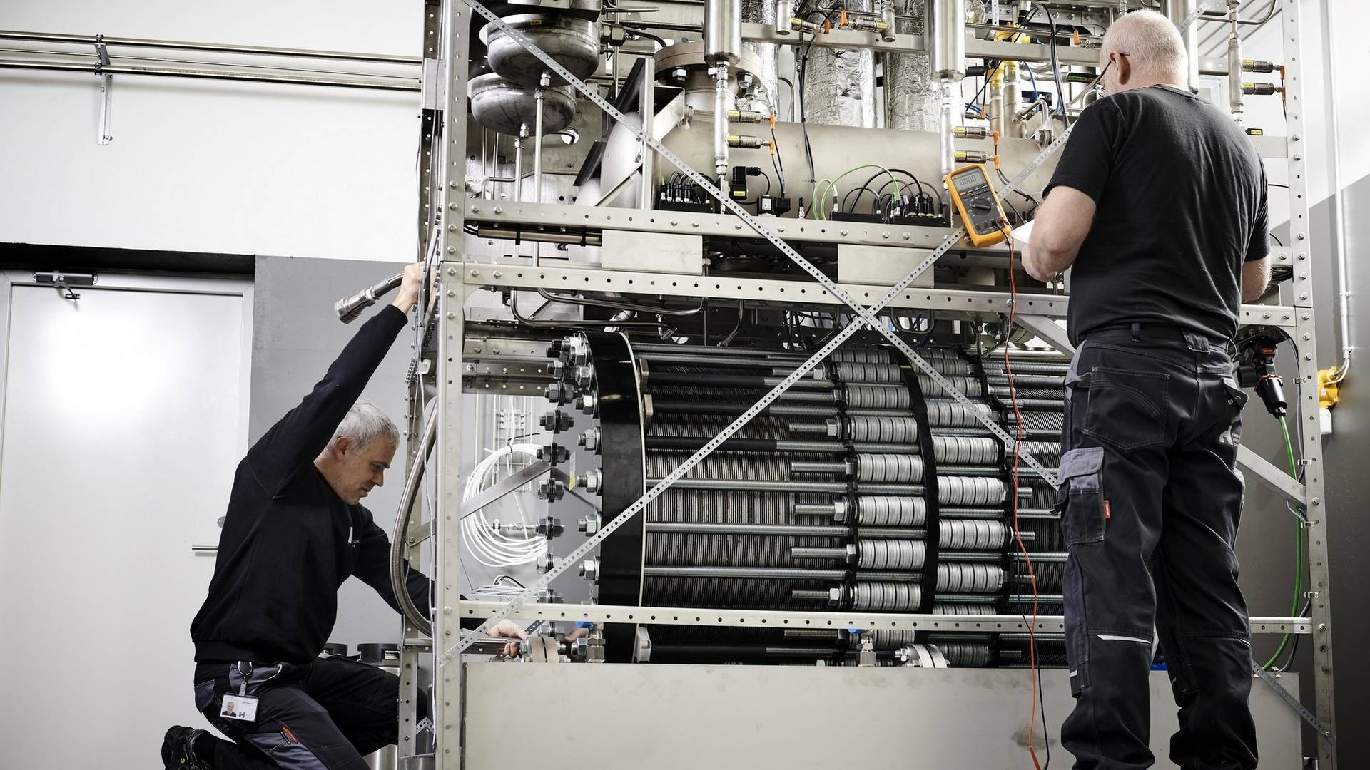 Technician Creating Hydrogen-powered Generators Background