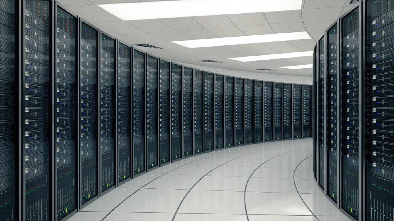 Technological Powerhouse: Inside A Winding Database Center Background