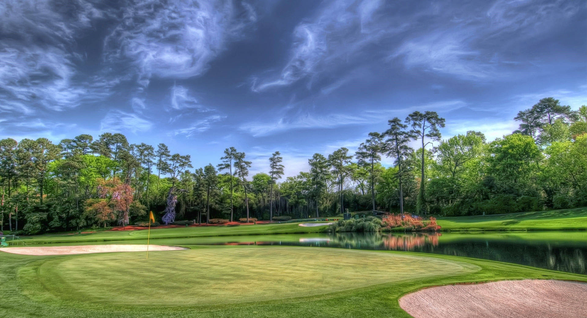 Tee Off And Enjoy A Round Of Golf With A View Of Nature Background