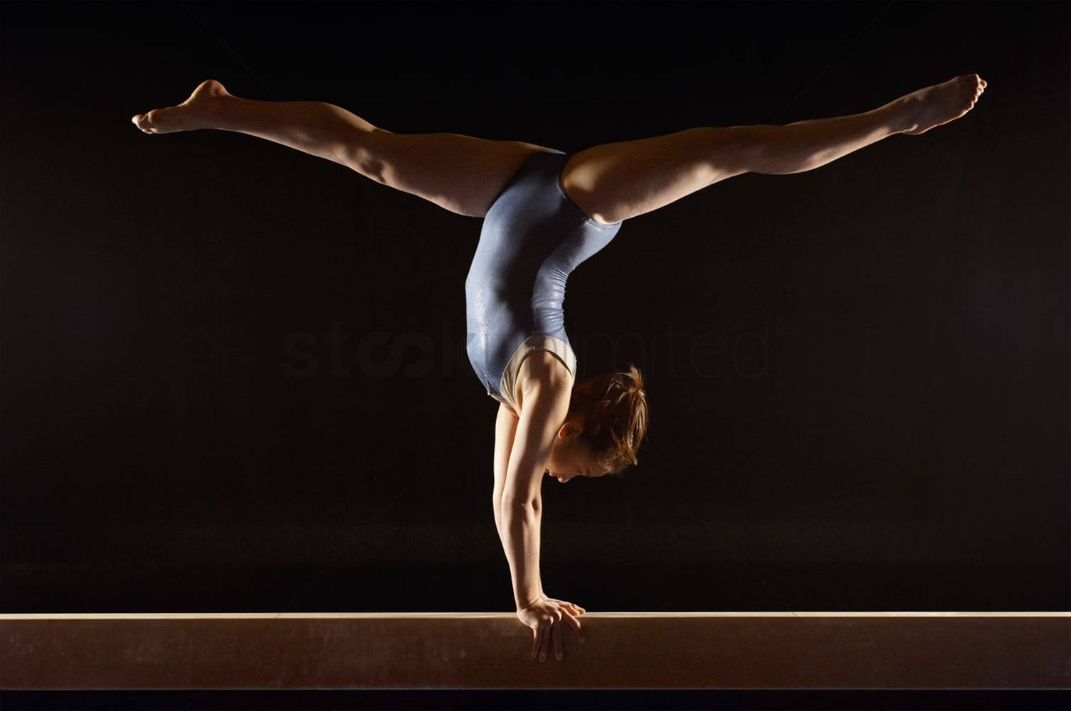 Teen Girl Handstand On Balance Beam Background