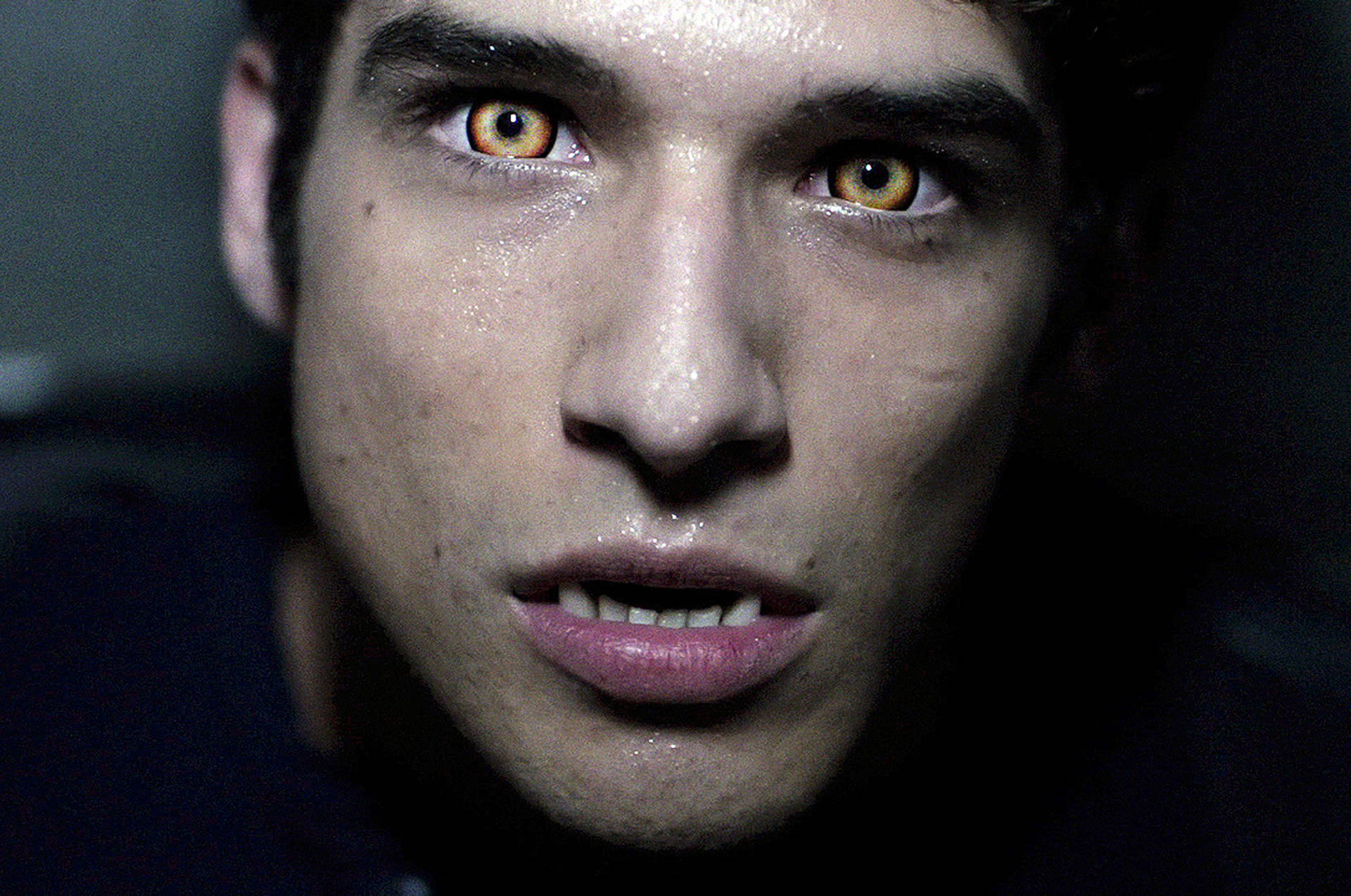 Teen Wolf Star, Tyler Posey Looking Thoughtful In An Outdoor Scene Background