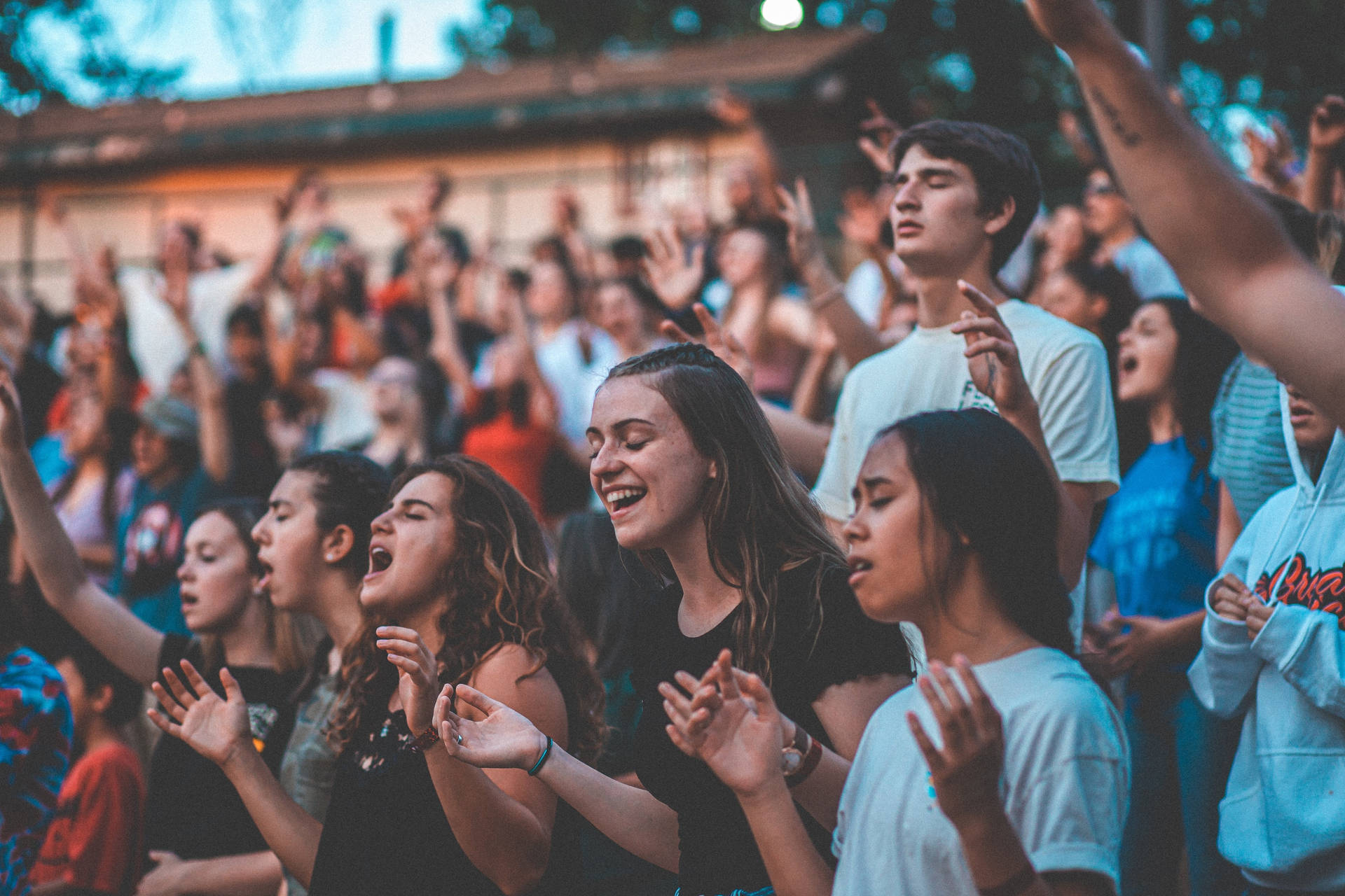 Teenage Girls In A Worship Concert Background