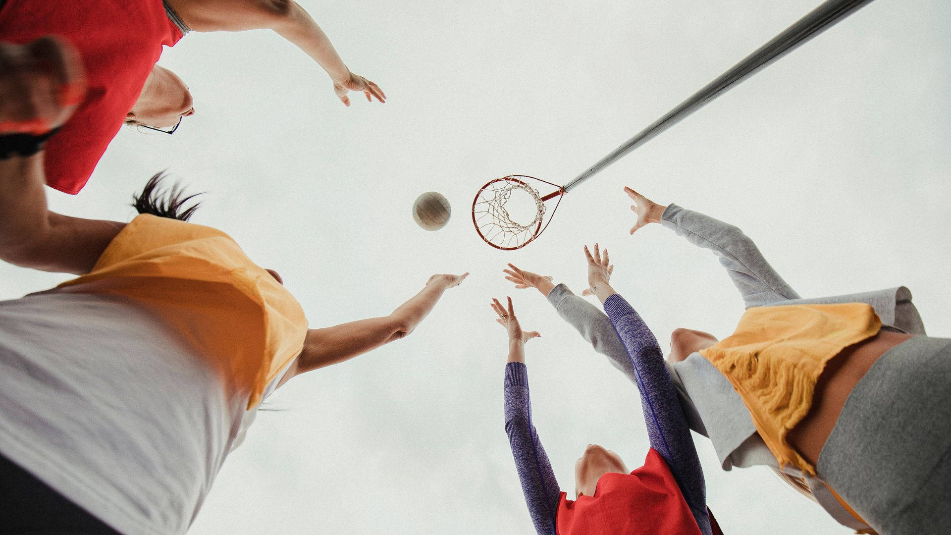 Teenage Girls Playing Netball Waiting Catch Ball