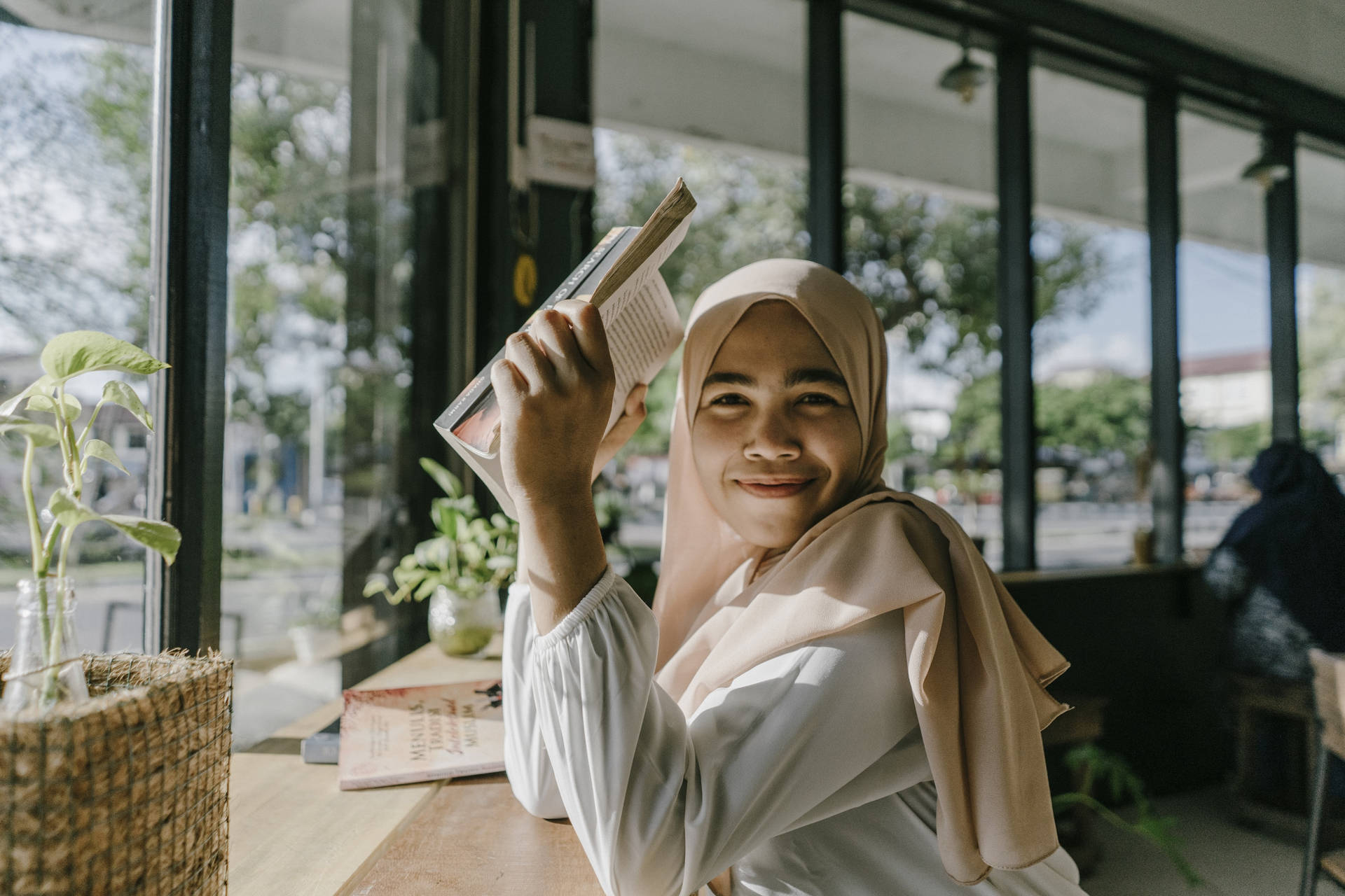 Teenage Muslim Girl Holding A Book