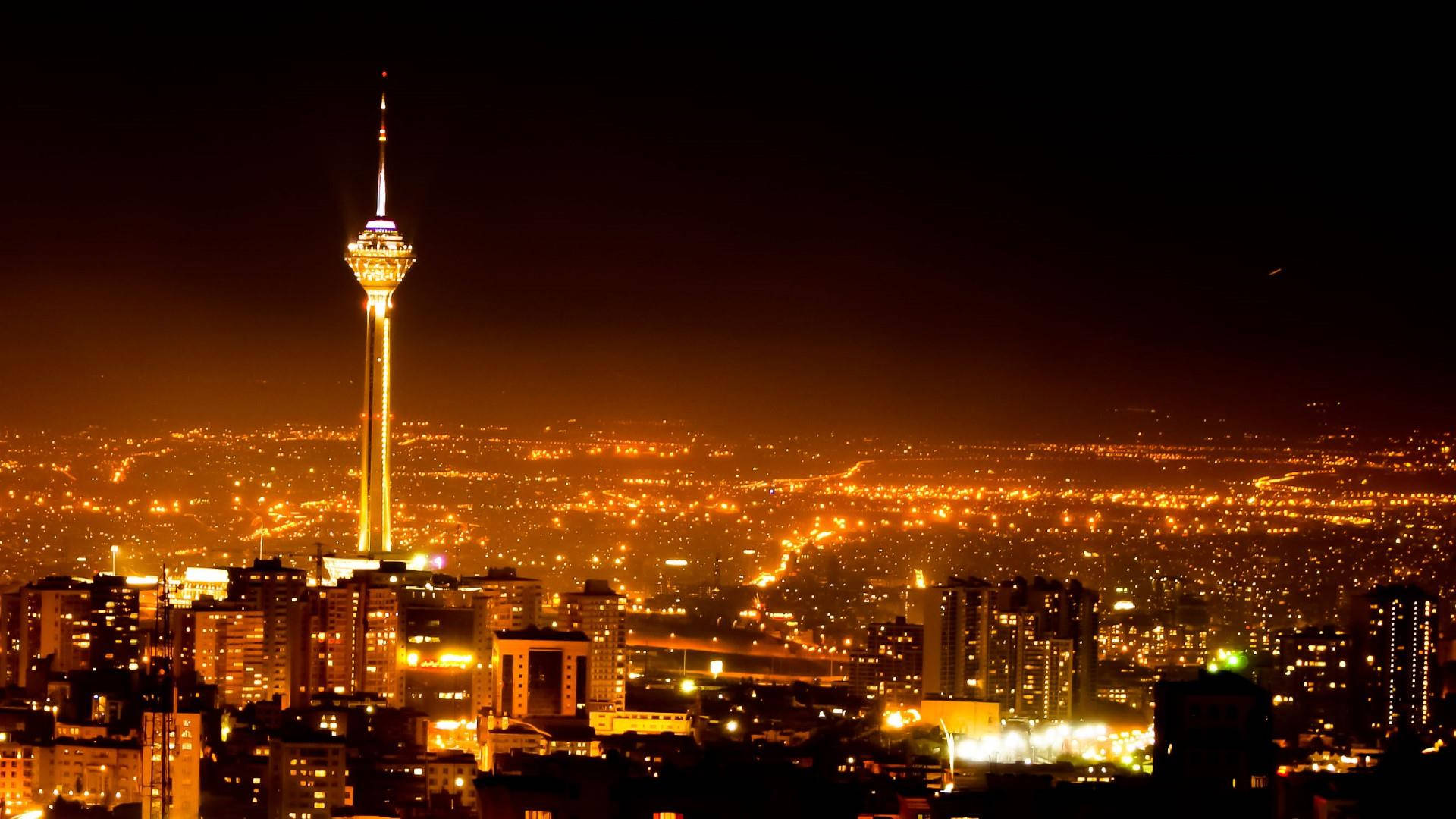 Tehran Orange Glow At Night Background