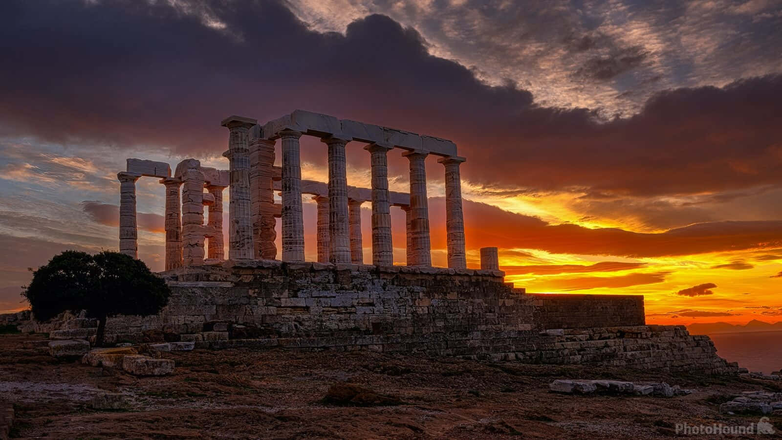 Temple Of Poseidon At Sunset Background