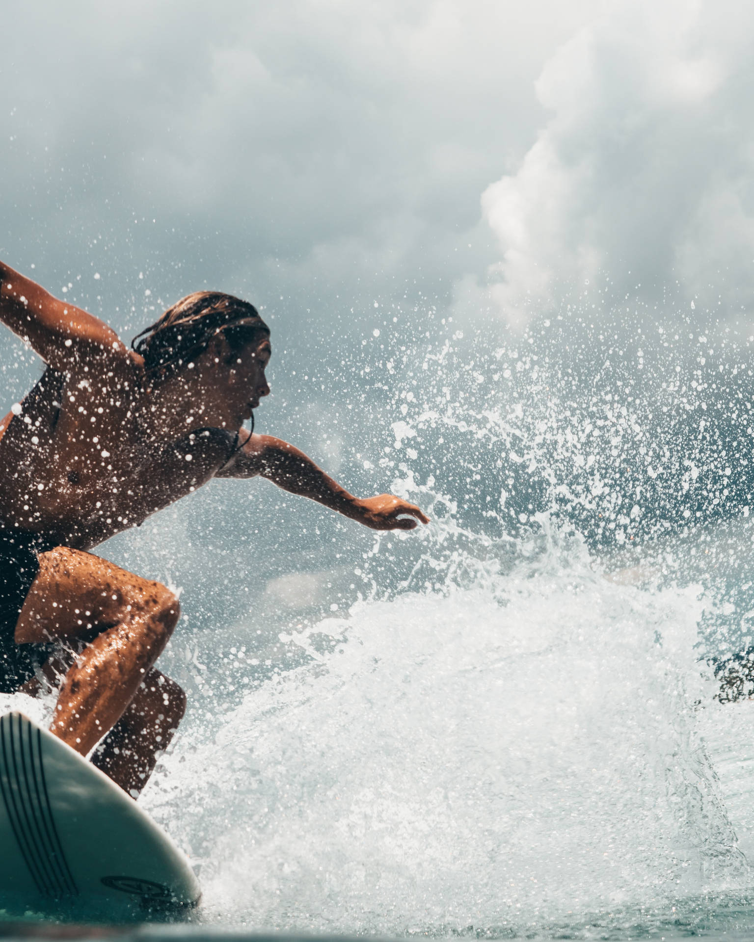 Tenacious Surfer On Surfing Board Background