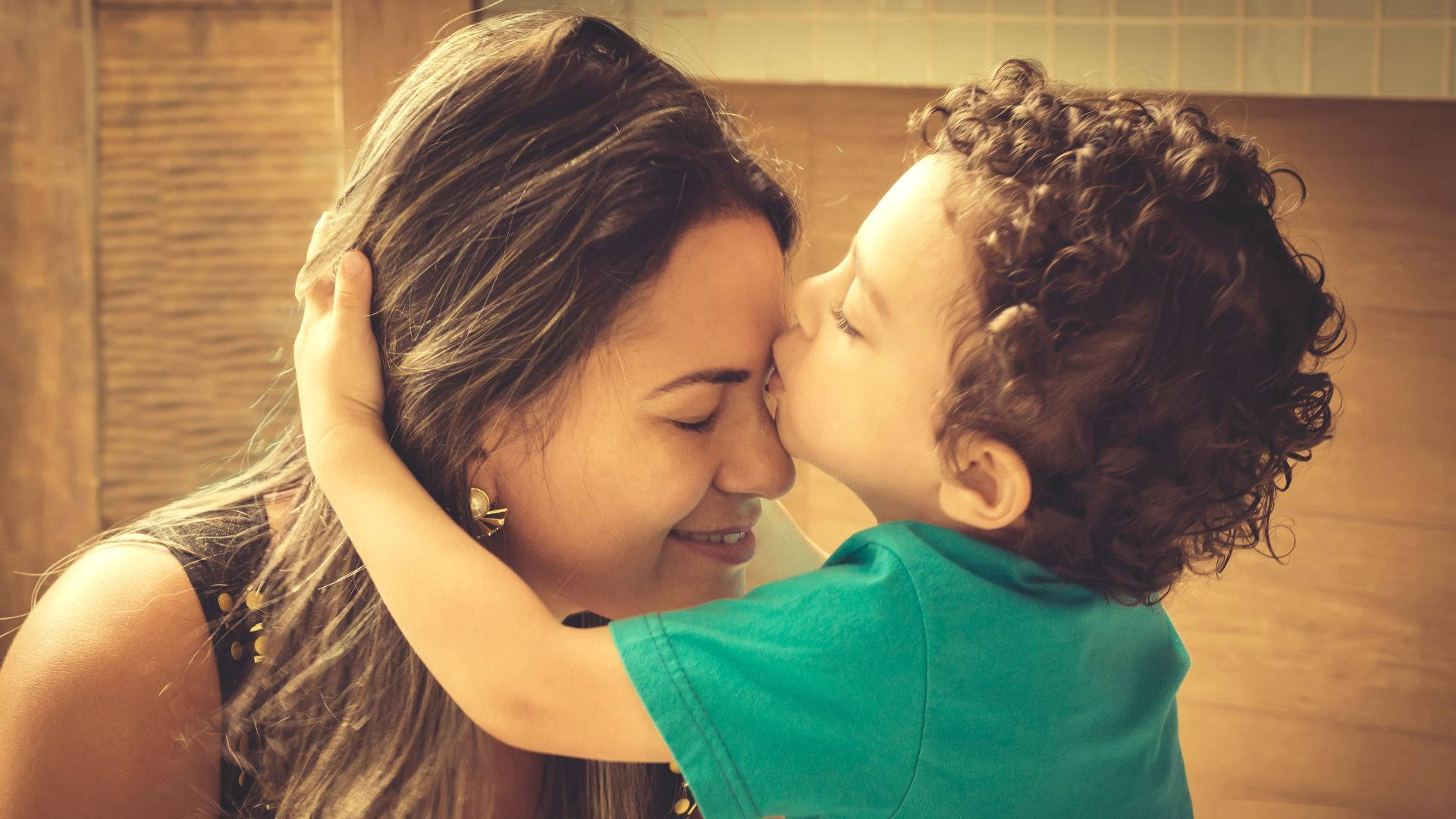 Tender Moments: Boy Kissing His Mom Background