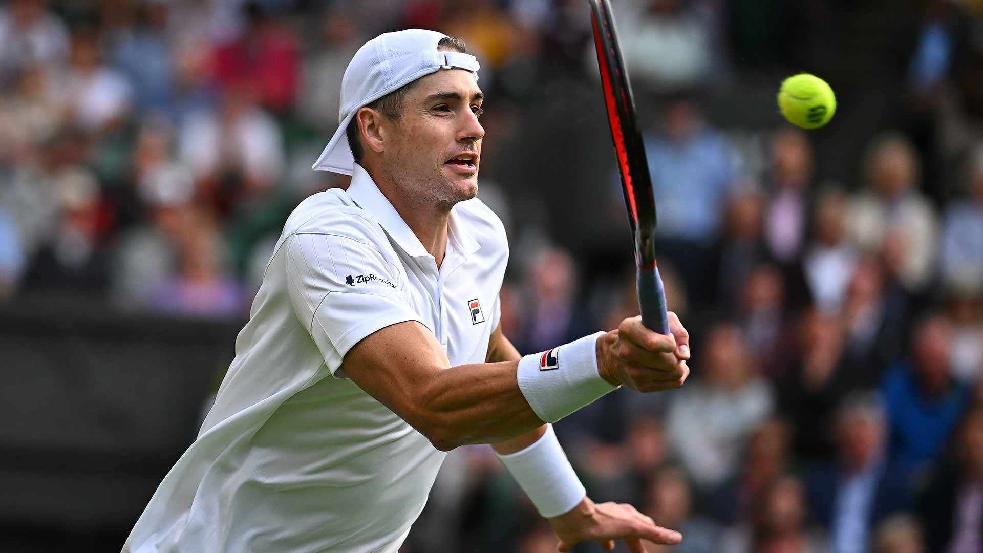 Tennis Athlete John Isner In Action Background