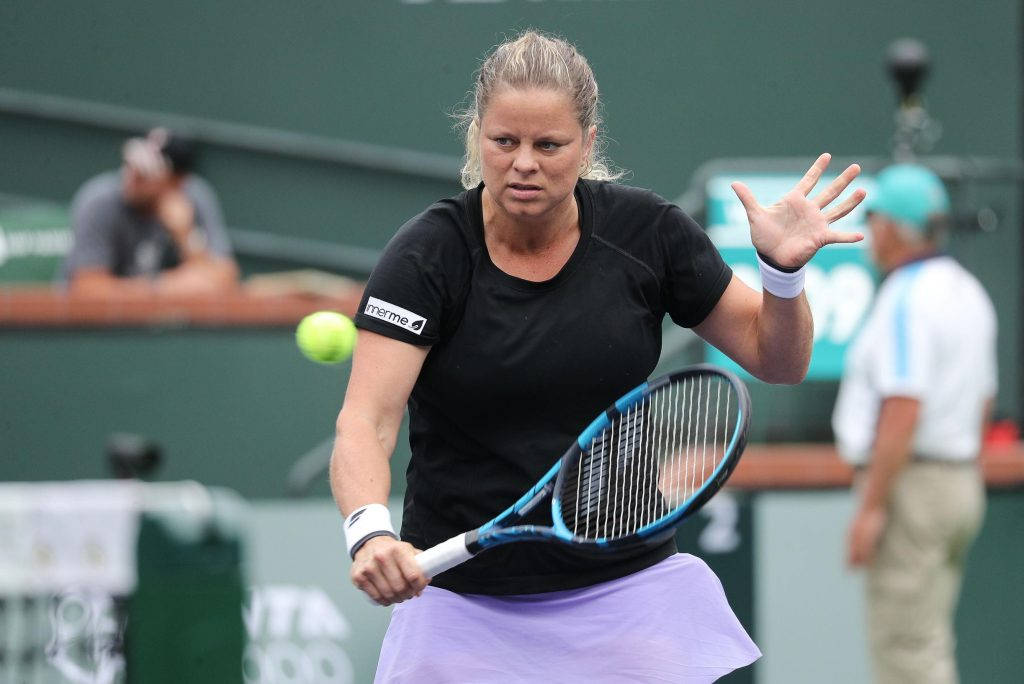 Tennis Champion Kim Clijsters In Action Background