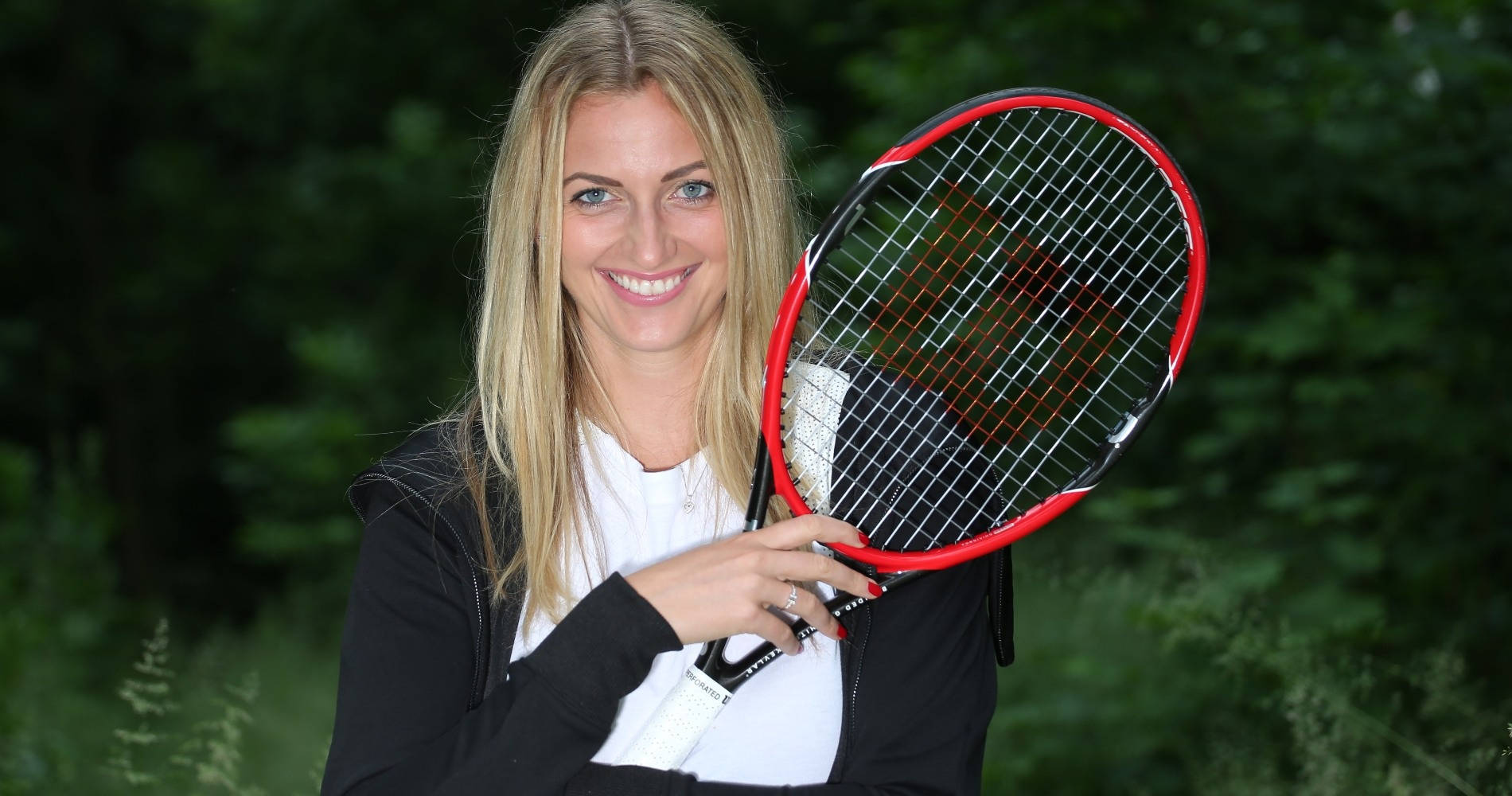 Tennis Champion - Petra Kvitova Holding Her Racket Background