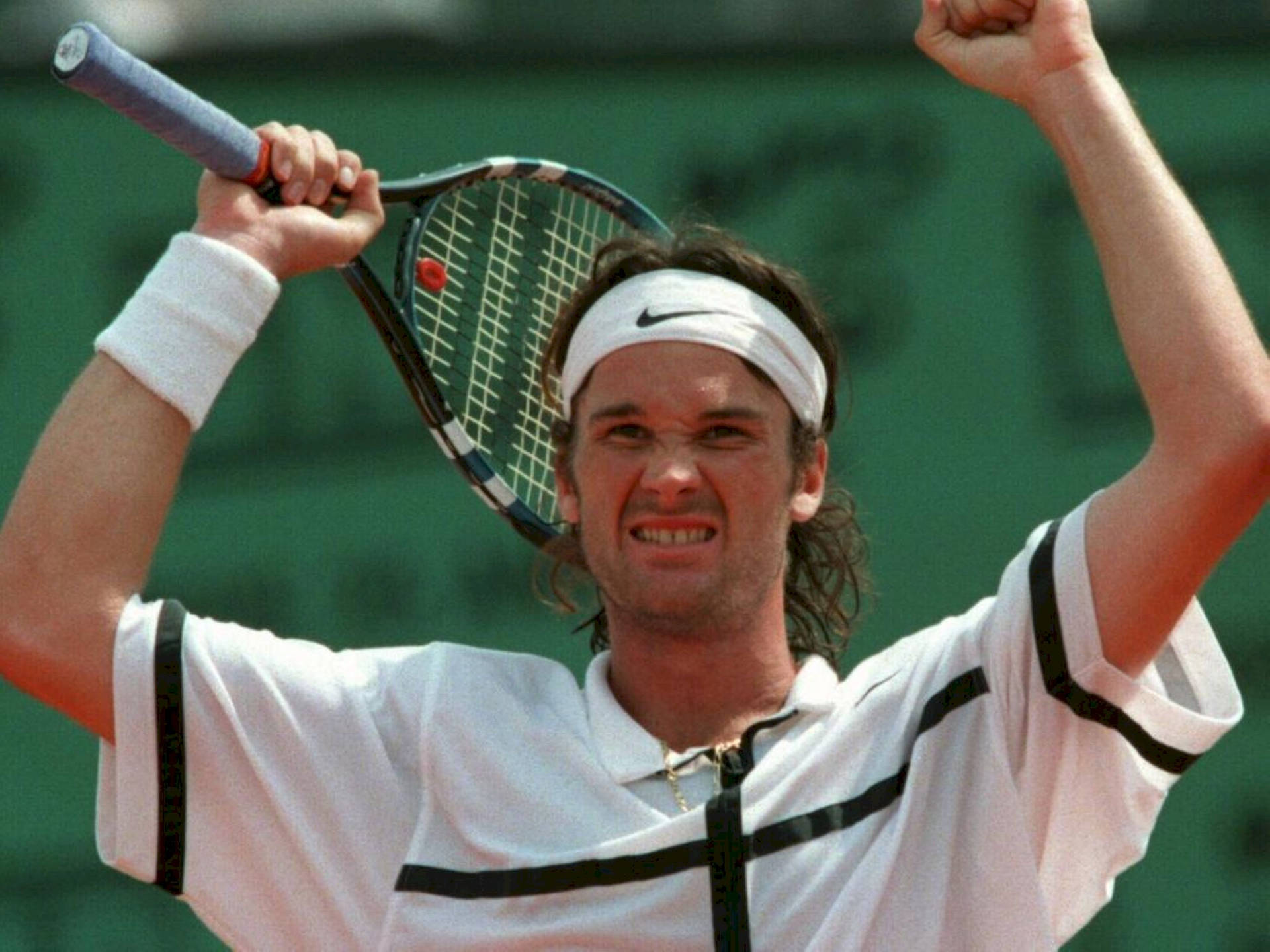 Tennis Icon Carlos Moya In A Candid Moment Background