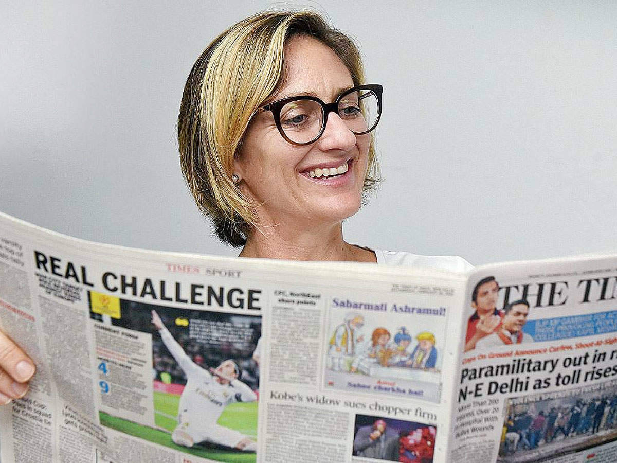 Tennis Legend Mary Pierce Reading Newspaper Background