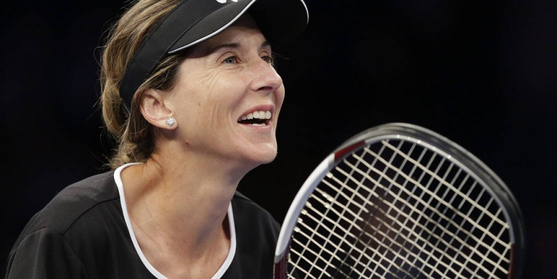 Tennis Legend Monica Seles Smiling During A Game Background