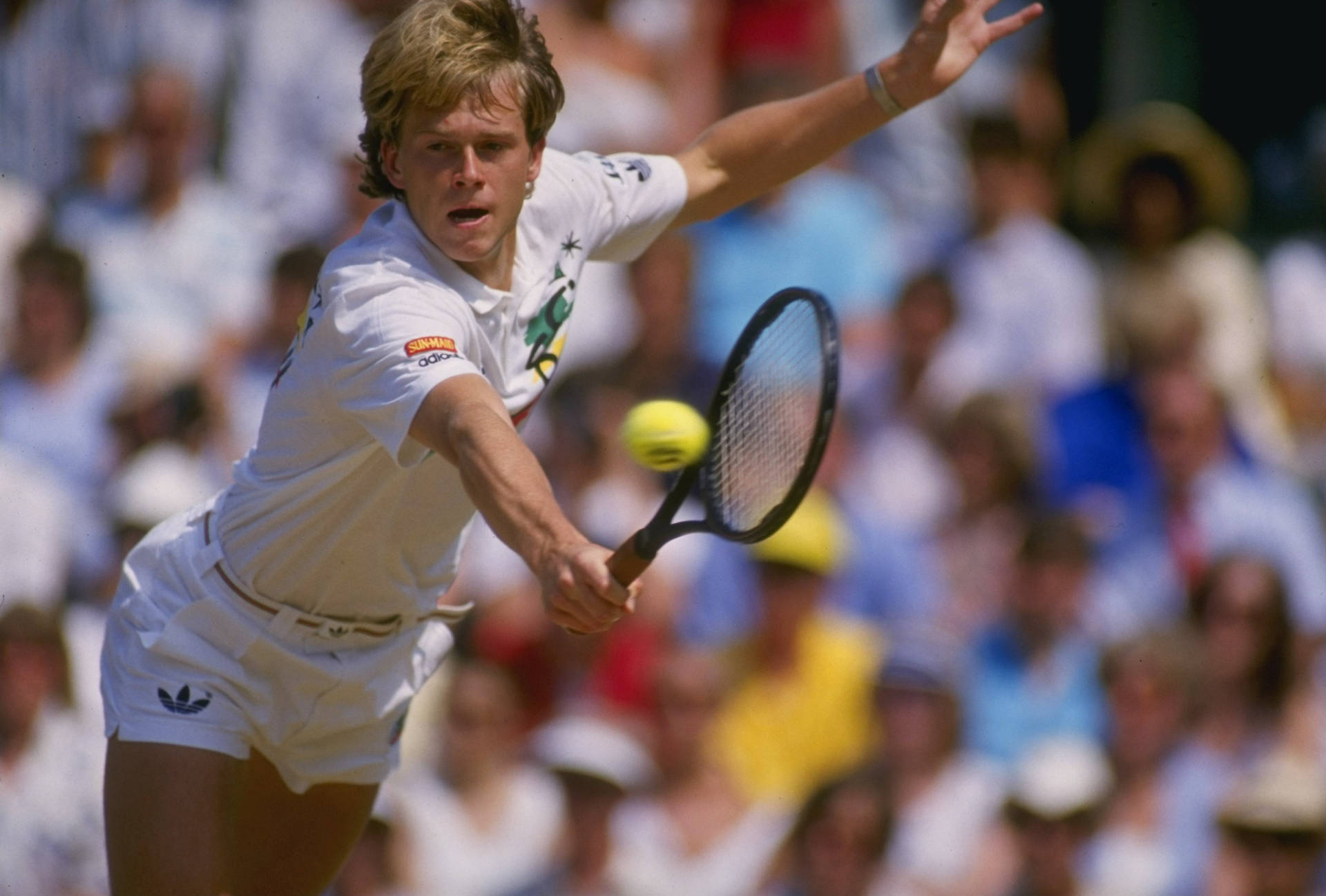 Tennis Legend Stefan Edberg Executing A Powerful Backhand Stroke. Background