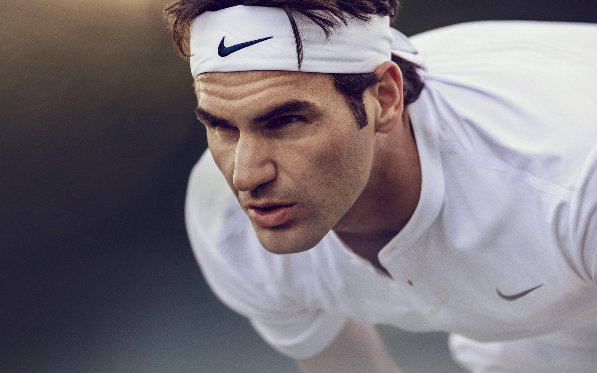Tennis Maestro Roger Federer In Action Background