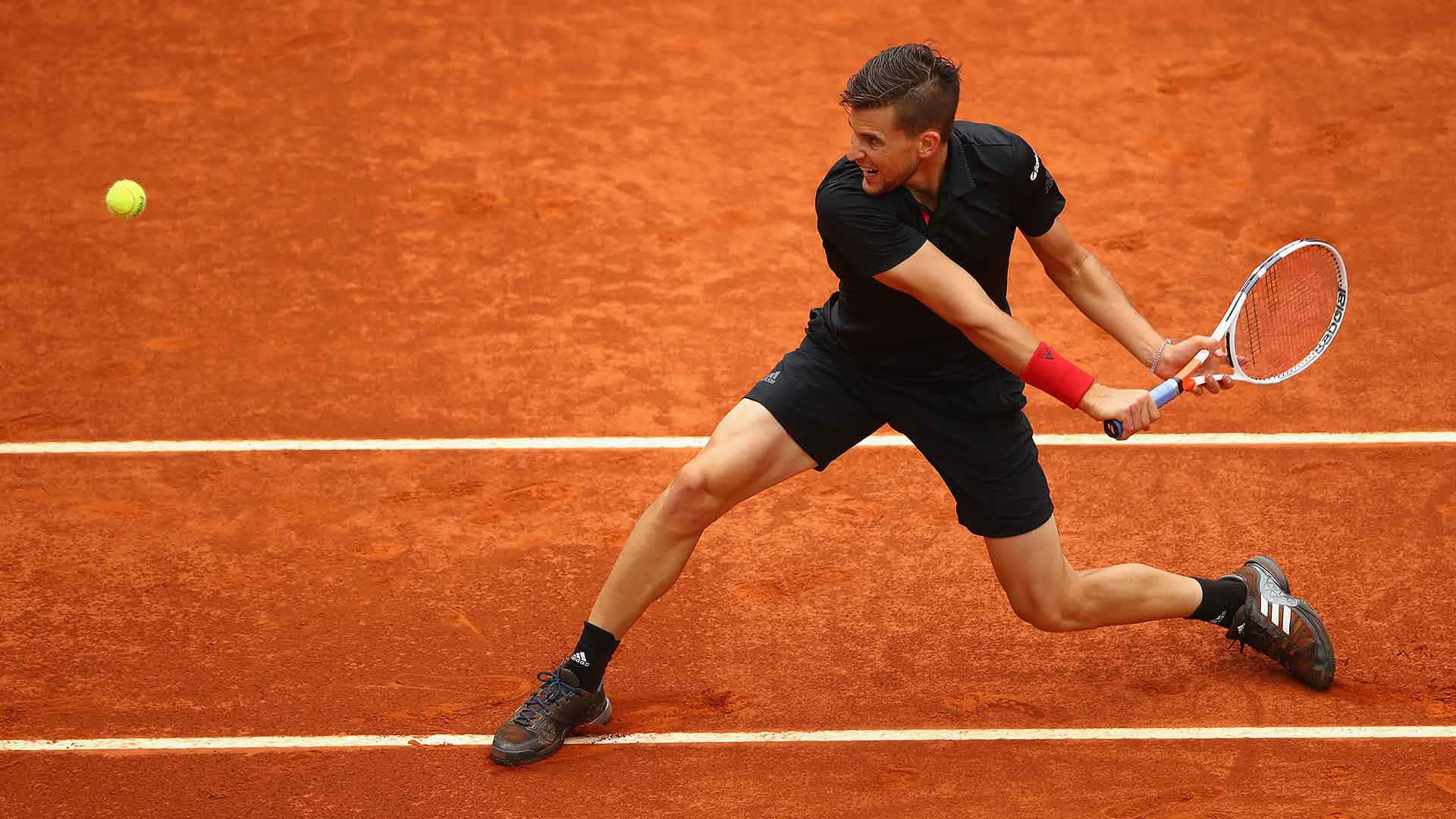 Tennis Player Backhandon Clay Court Background
