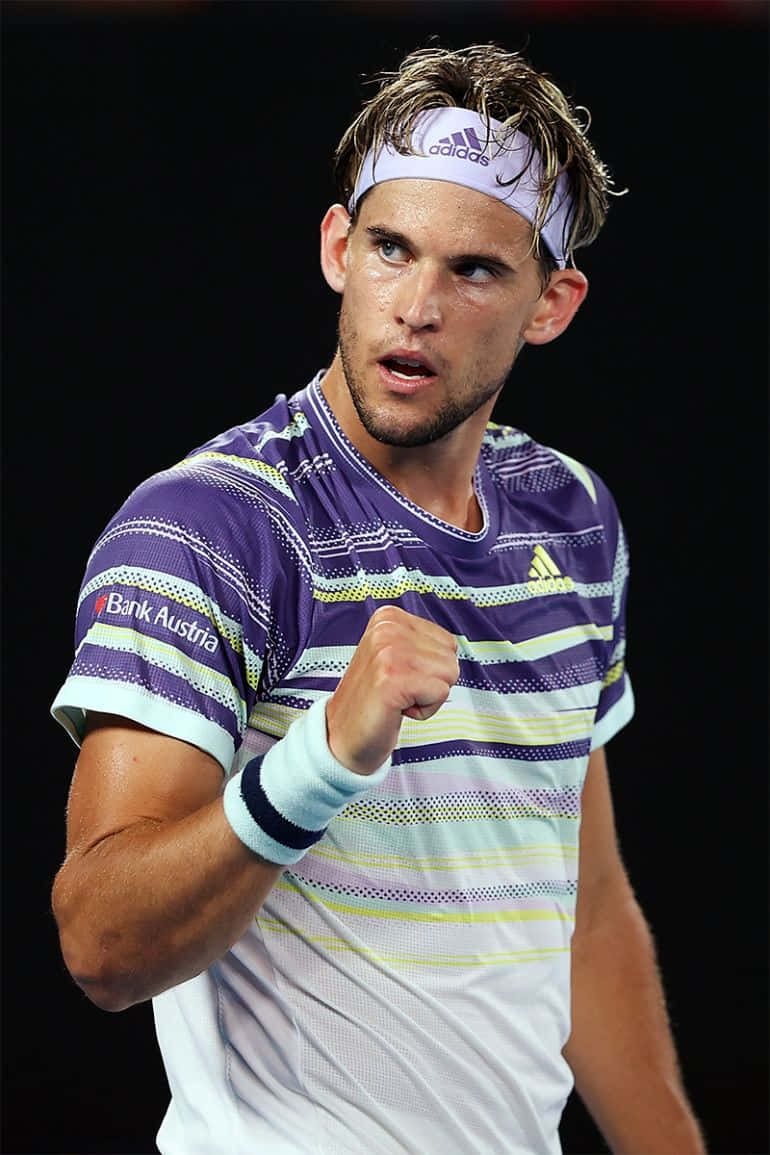 Tennis Player Celebrating Victory Background