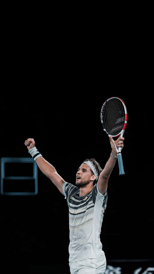 Tennis Player Celebrating Victory Background
