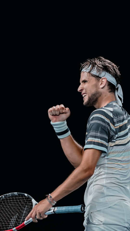 Tennis Player Celebrating Victory Background