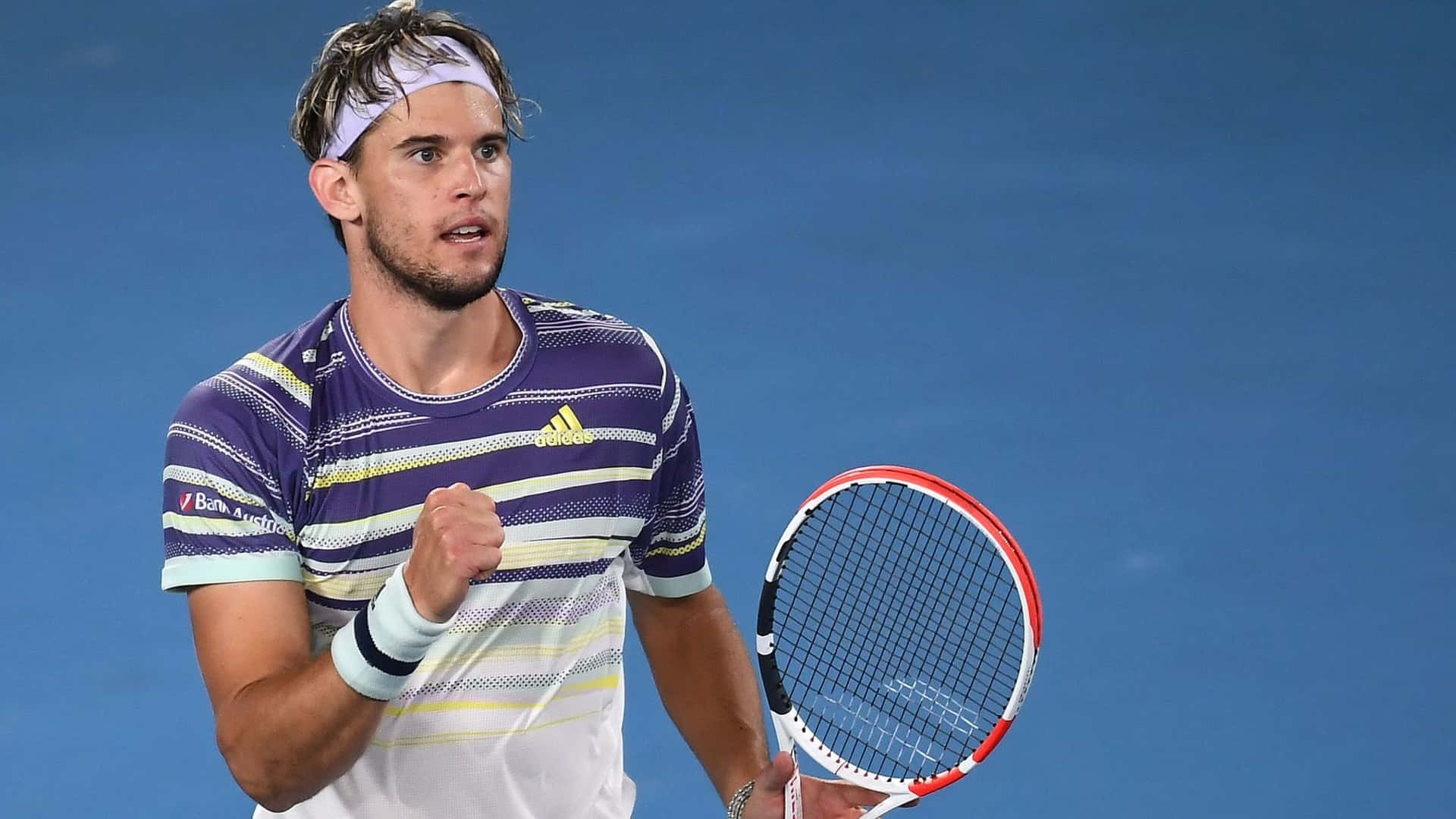 Tennis Player Celebrating Victory Background