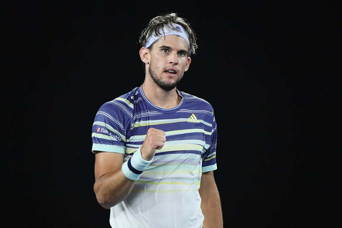 Tennis Player Celebrating Victory Background