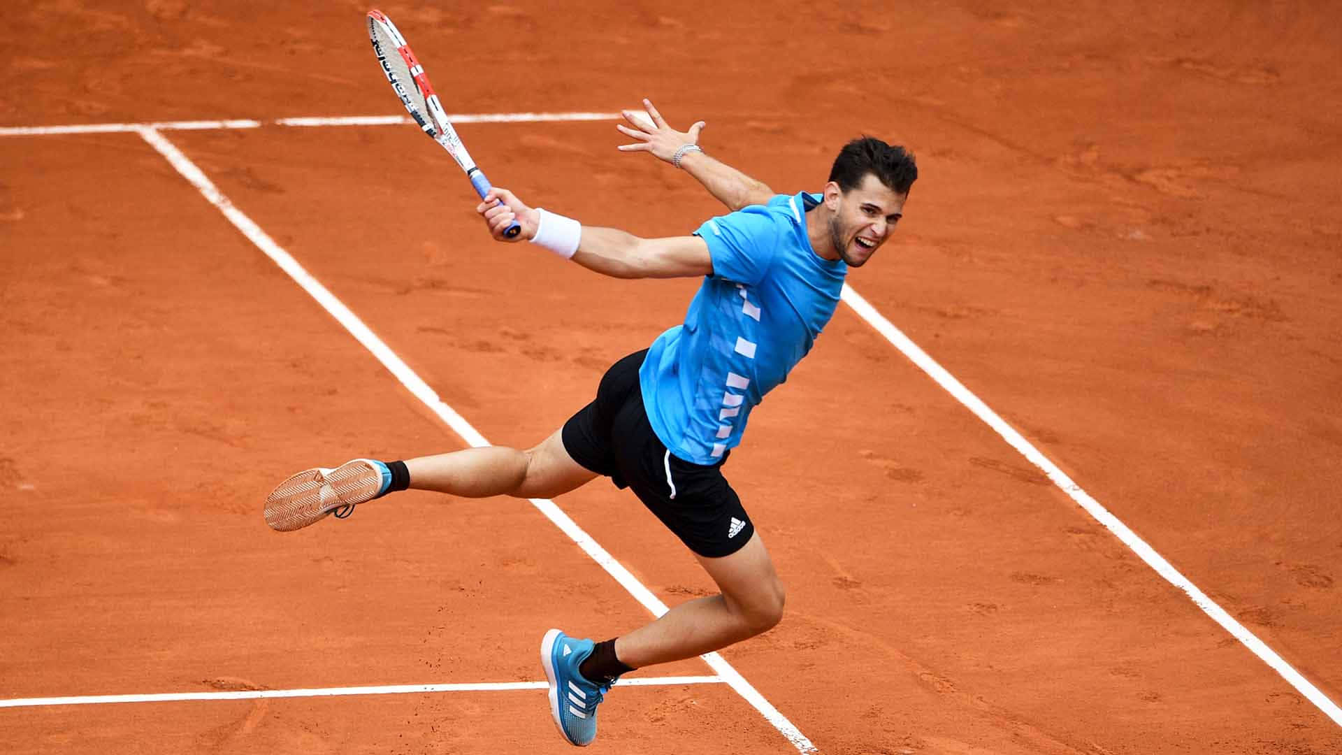 Tennis Player Stretchingfora Shoton Clay Court Background