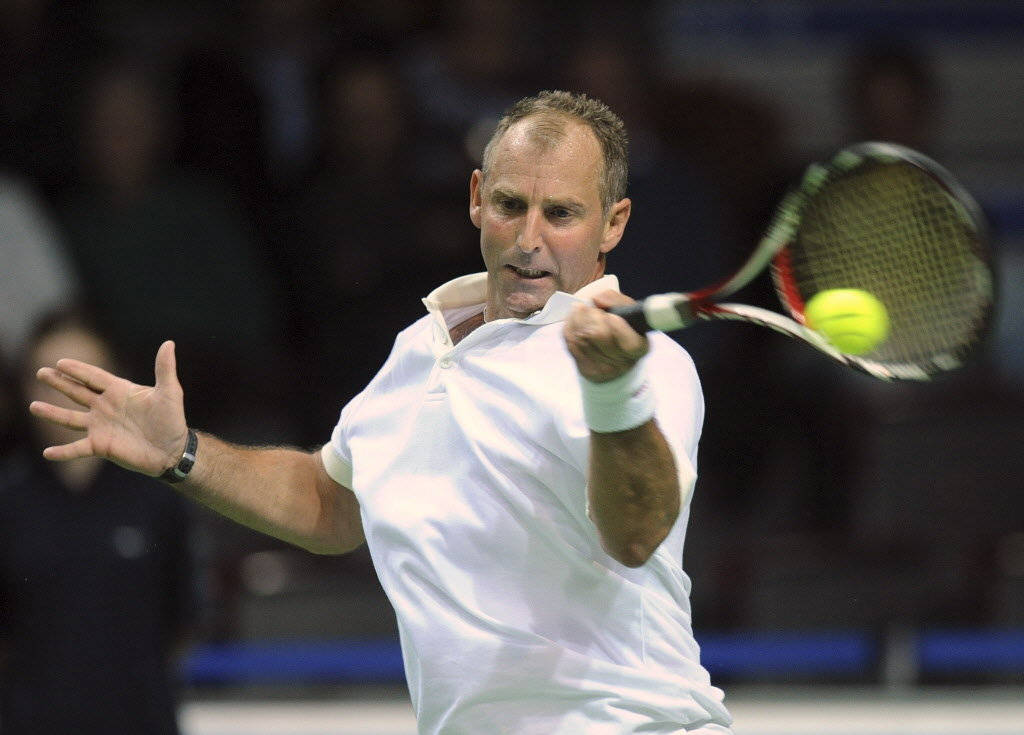 Tennis Player Thomas Muster Hitting Ball Background