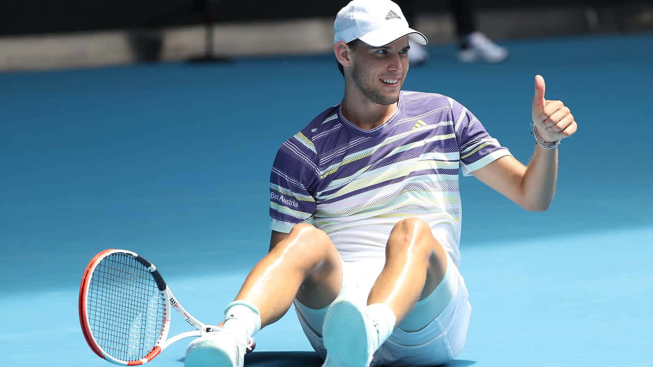 Tennis Player Thumbs Up On Court.jpg Background