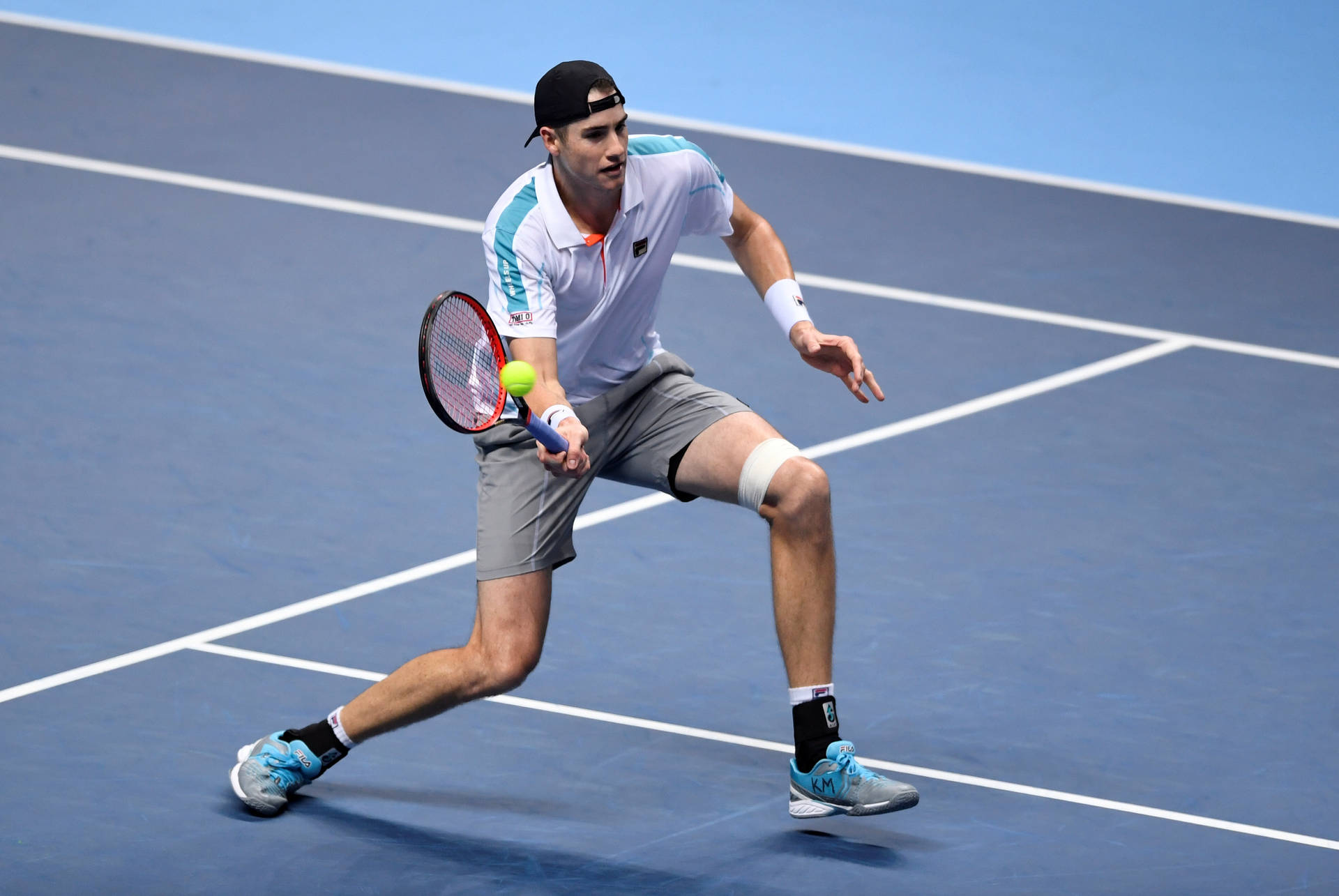 Tennis Pro John Isner Showcasing His Skills Background