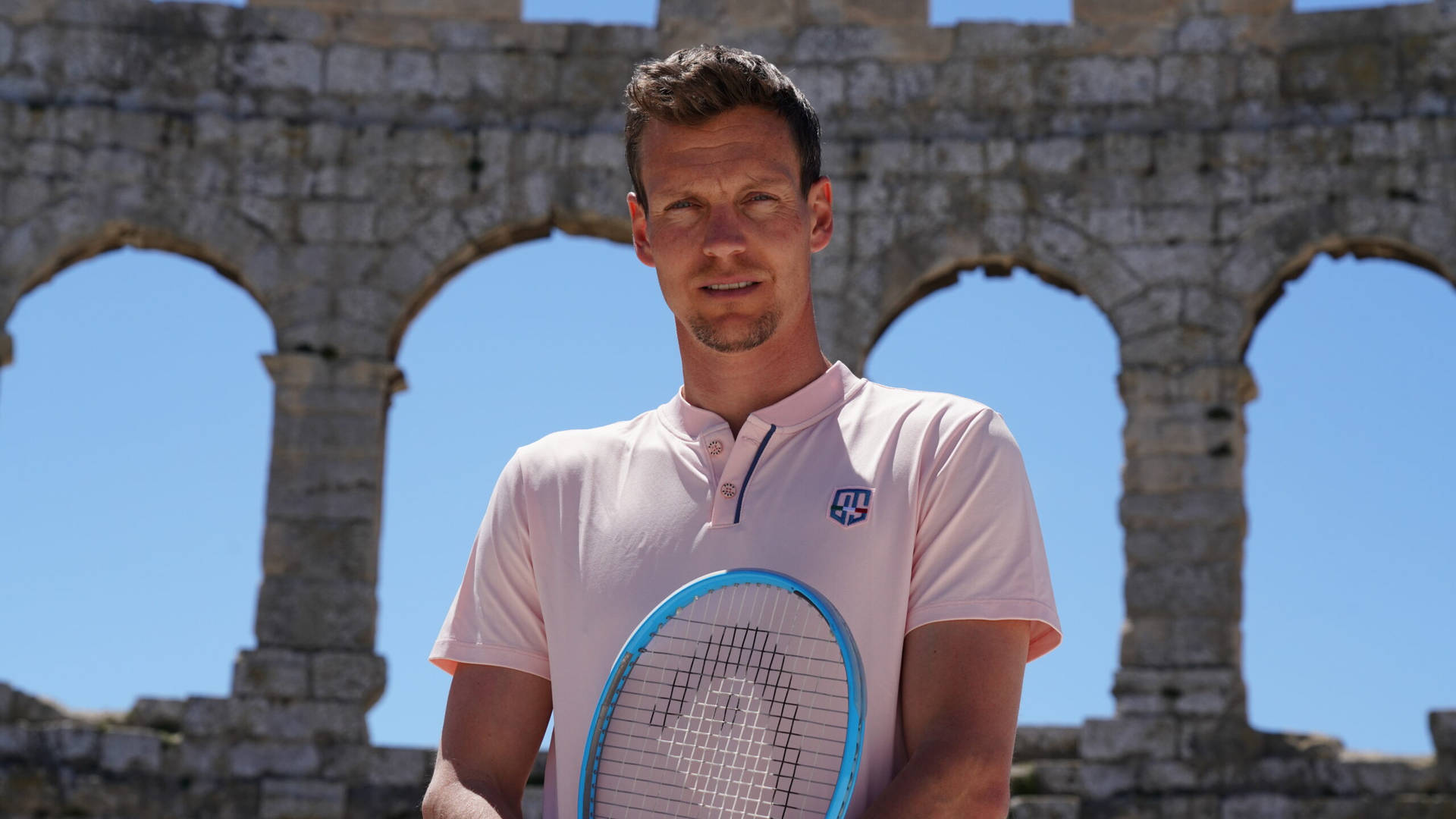 Tennis Star Tomas Berdych Against An Old Stone Wall Backdrop. Background