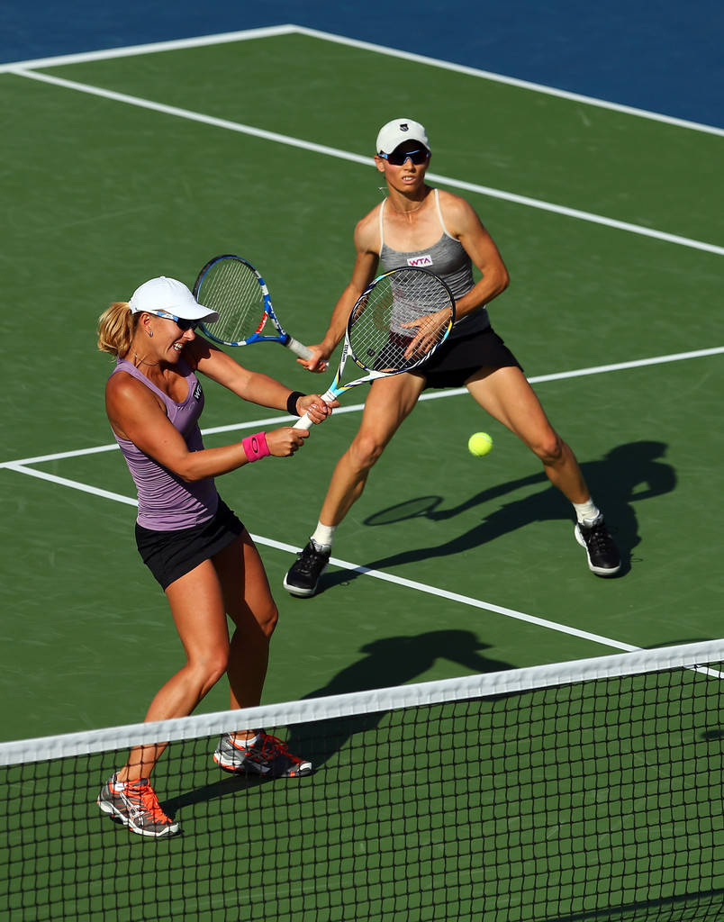 Tennis Stars Cara Black And Anastasia Rodionova In Action Background