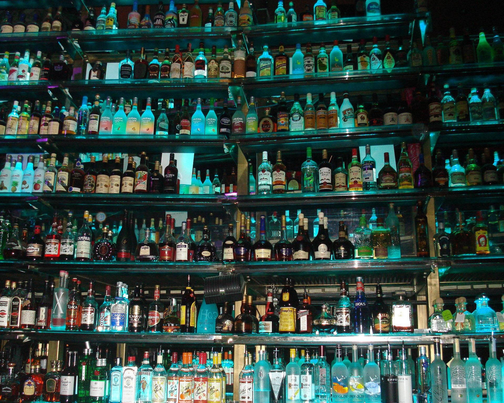 Tequila And Alcohol Bottles On Large Shelf