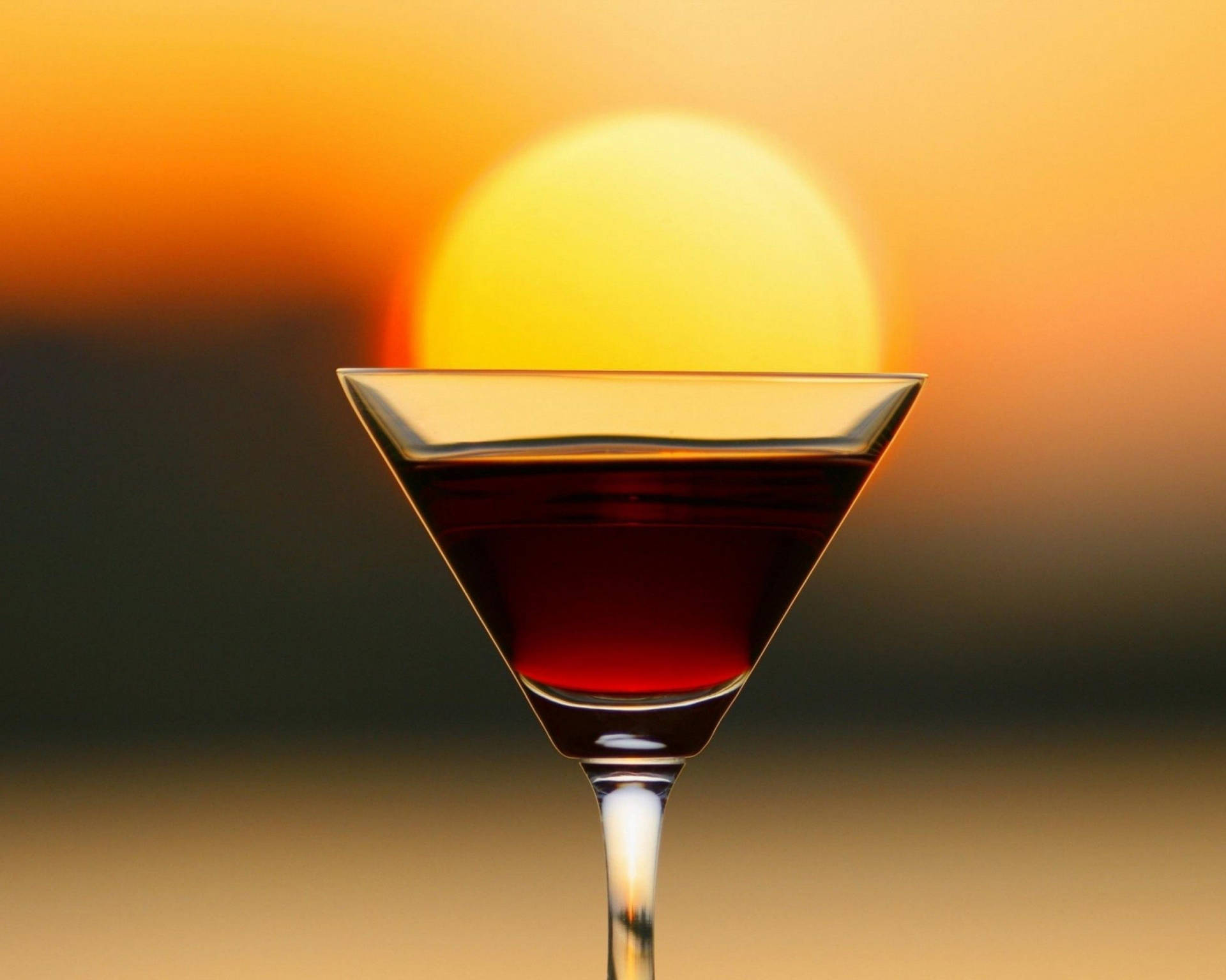 Tequila Drink At Sunset Background