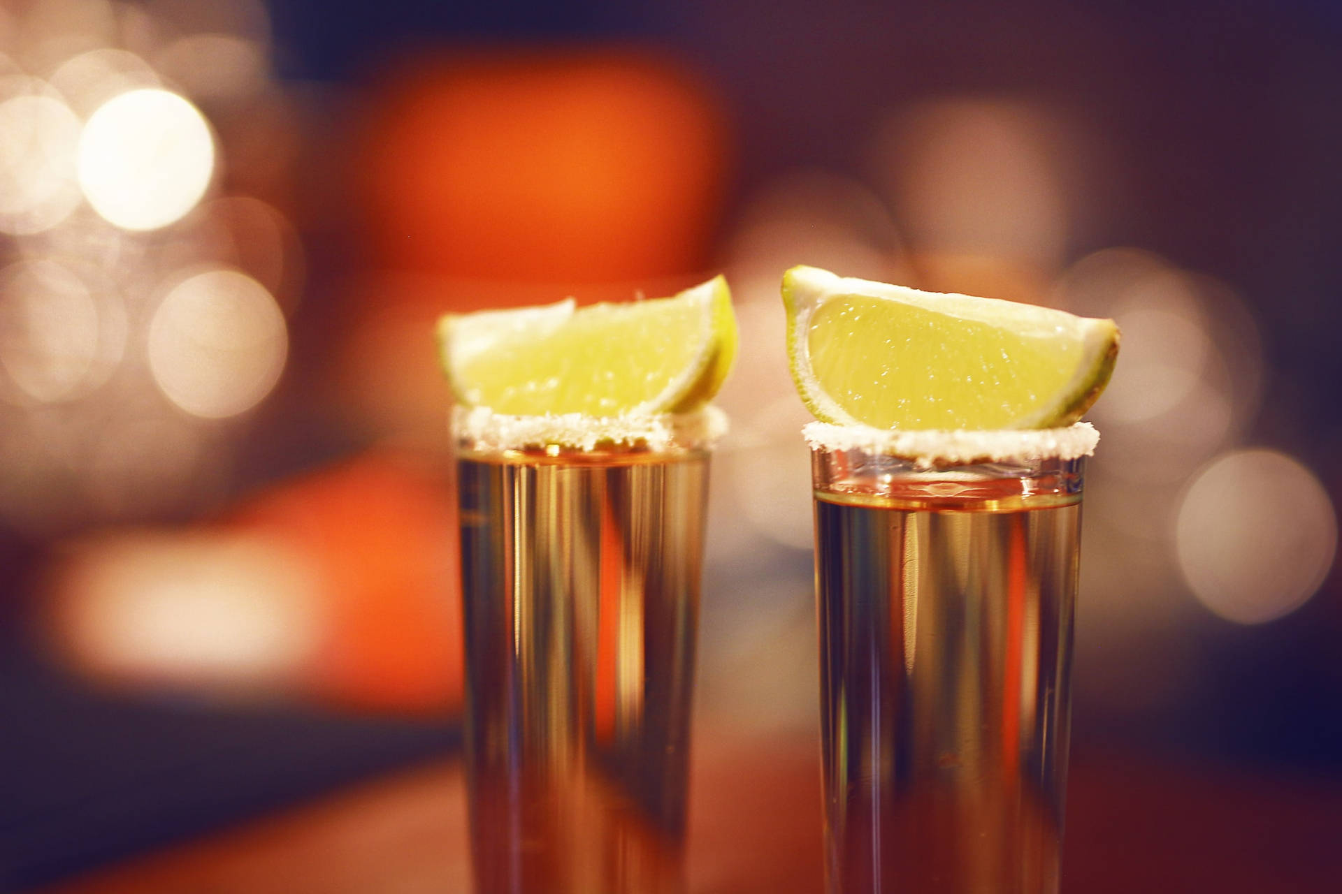 Tequila Glasses Topped With Lemon Background