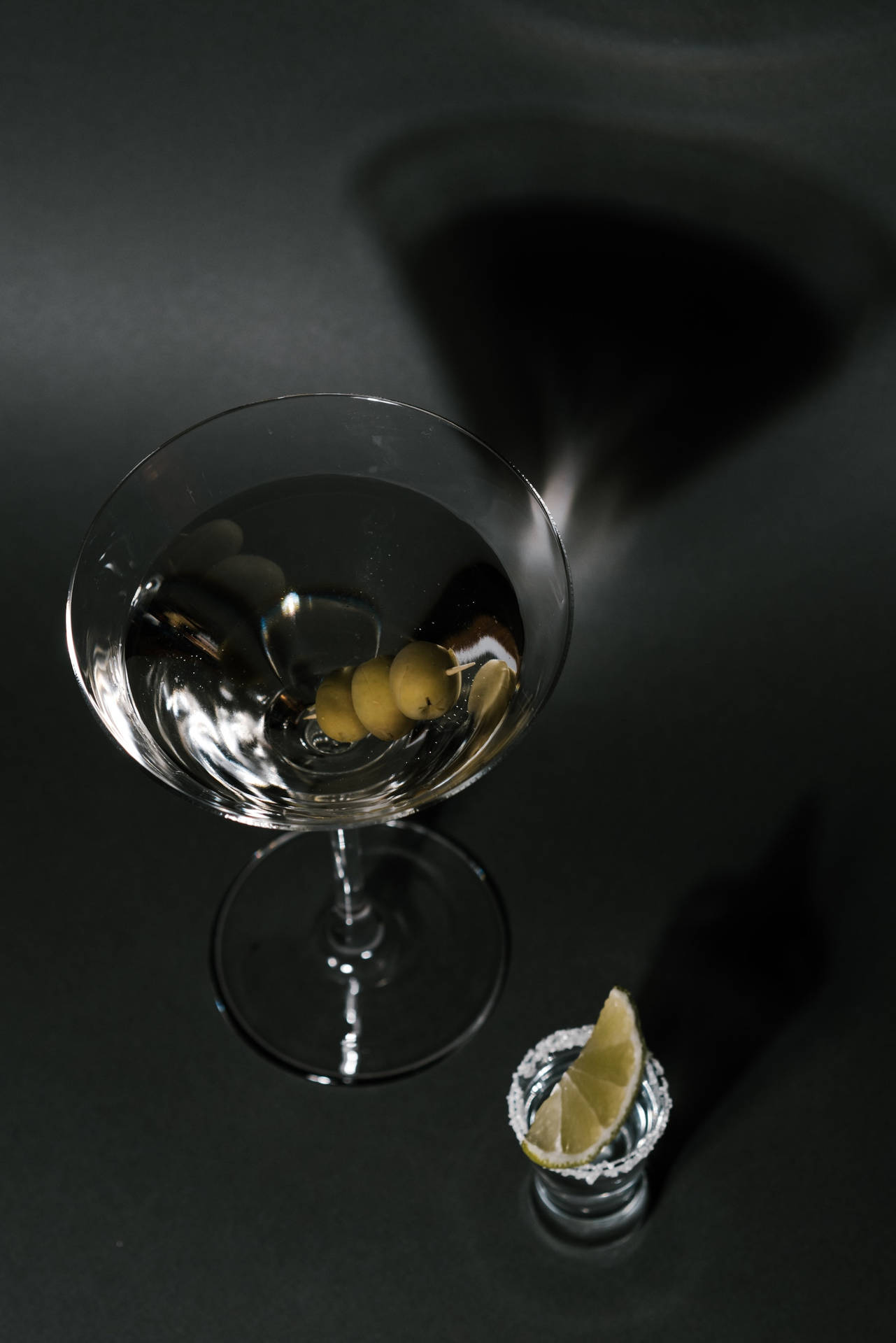 Tequila Martini With Olives And Lemon Slice Background