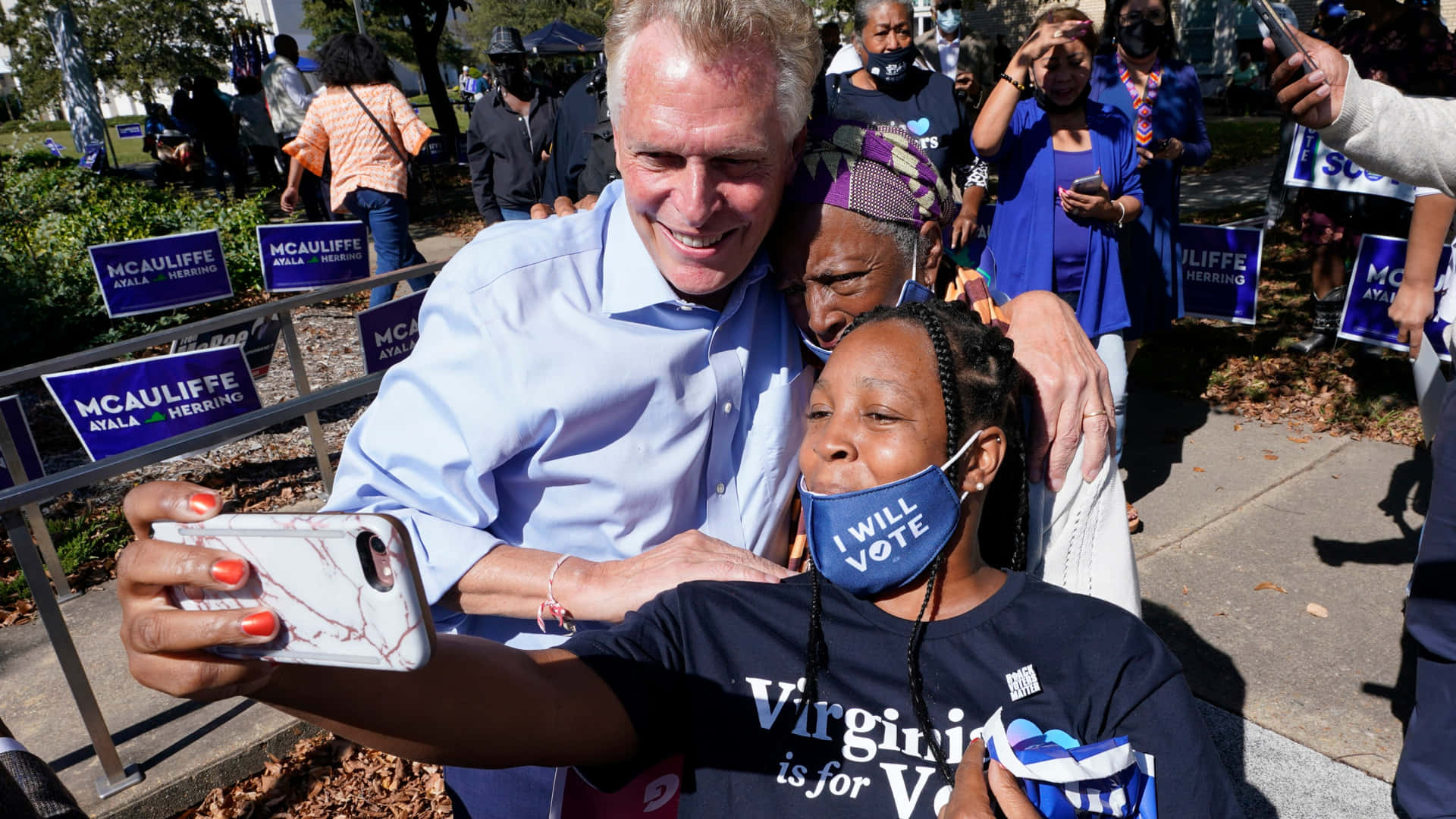 Terry Mcauliffe Captures A Selfie Moment With Supporters Background